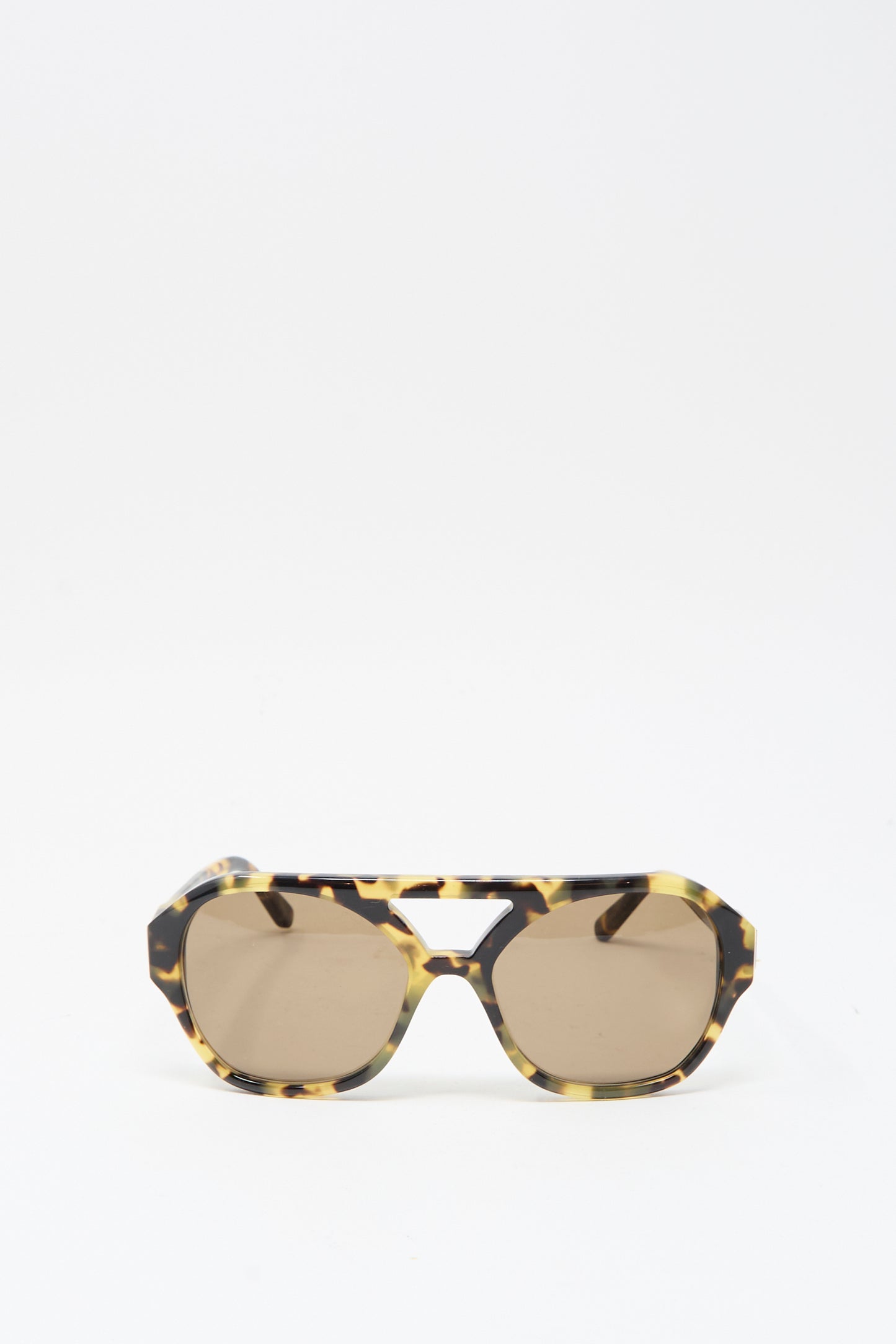 Eva Masaki's Chiyo Aviator Sunglasses in Tokyo feature tortoiseshell-patterned Italian acetate frames, brown-tinted lenses, and UV protection, shown on a white background.
