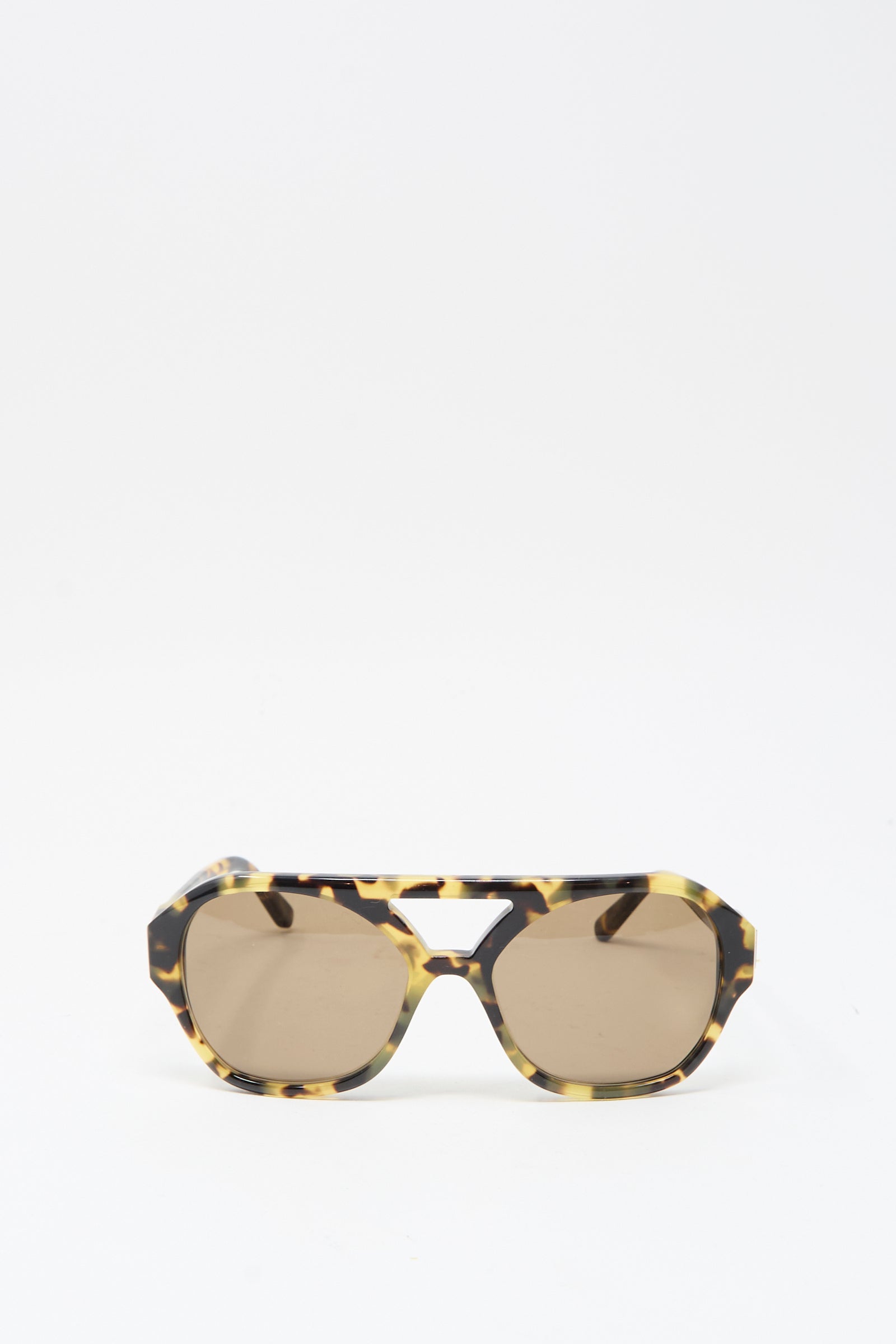 Eva Masaki's Chiyo Aviator Sunglasses in Tokyo feature tortoiseshell-patterned Italian acetate frames, brown-tinted lenses, and UV protection, shown on a white background.