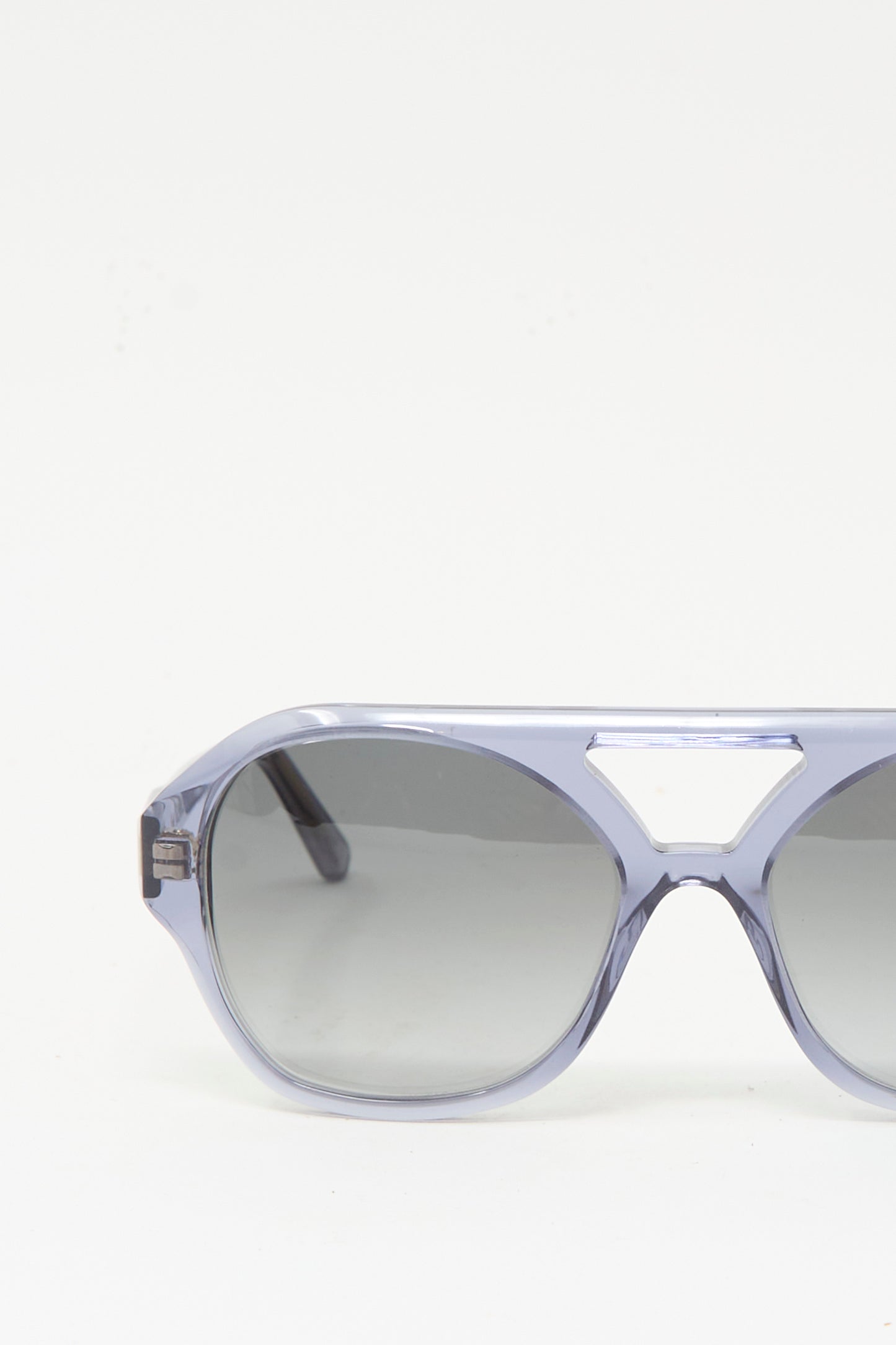 Close-up of the right side of Eva Masaki’s Chiyo Aviator Sunglasses in Waves, crafted from premium Italian acetate with a metal bridge and dark tinted lenses, set against a plain white background.