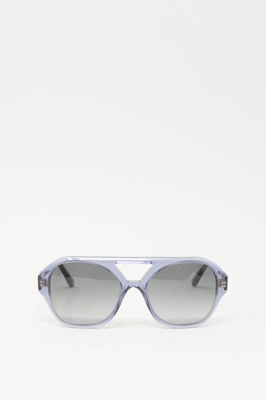 Chiyo Aviator Sunglasses in Waves by Eva Masaki feature gray lenses and translucent gray Italian acetate frames with UV protection, shown against a plain white background.