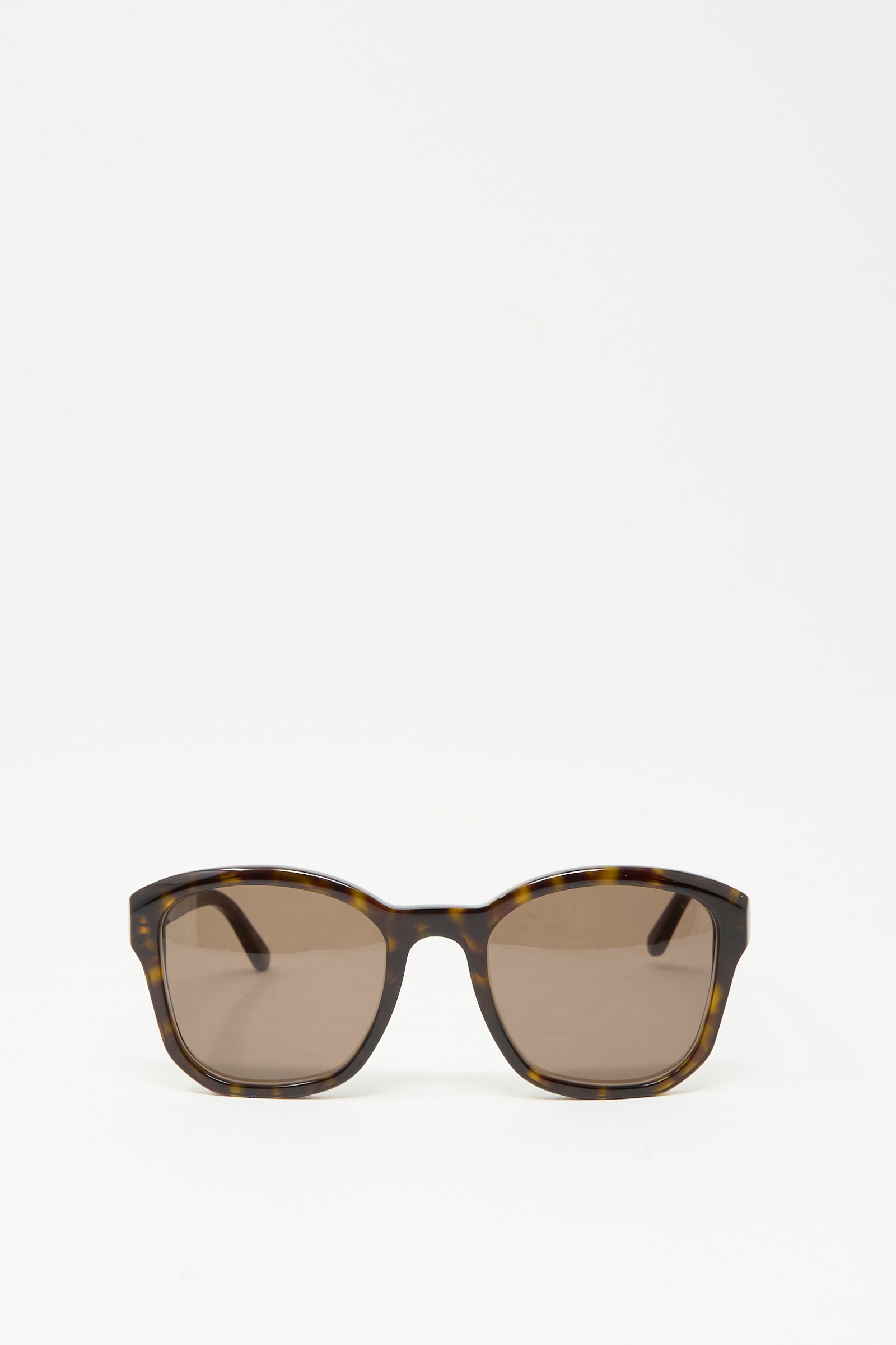 The Eva Masaki BQE Sunglasses in Finch feature oversized Havana tortoise shell frames and brown lenses with 100% UV protection, shown against a plain white background.