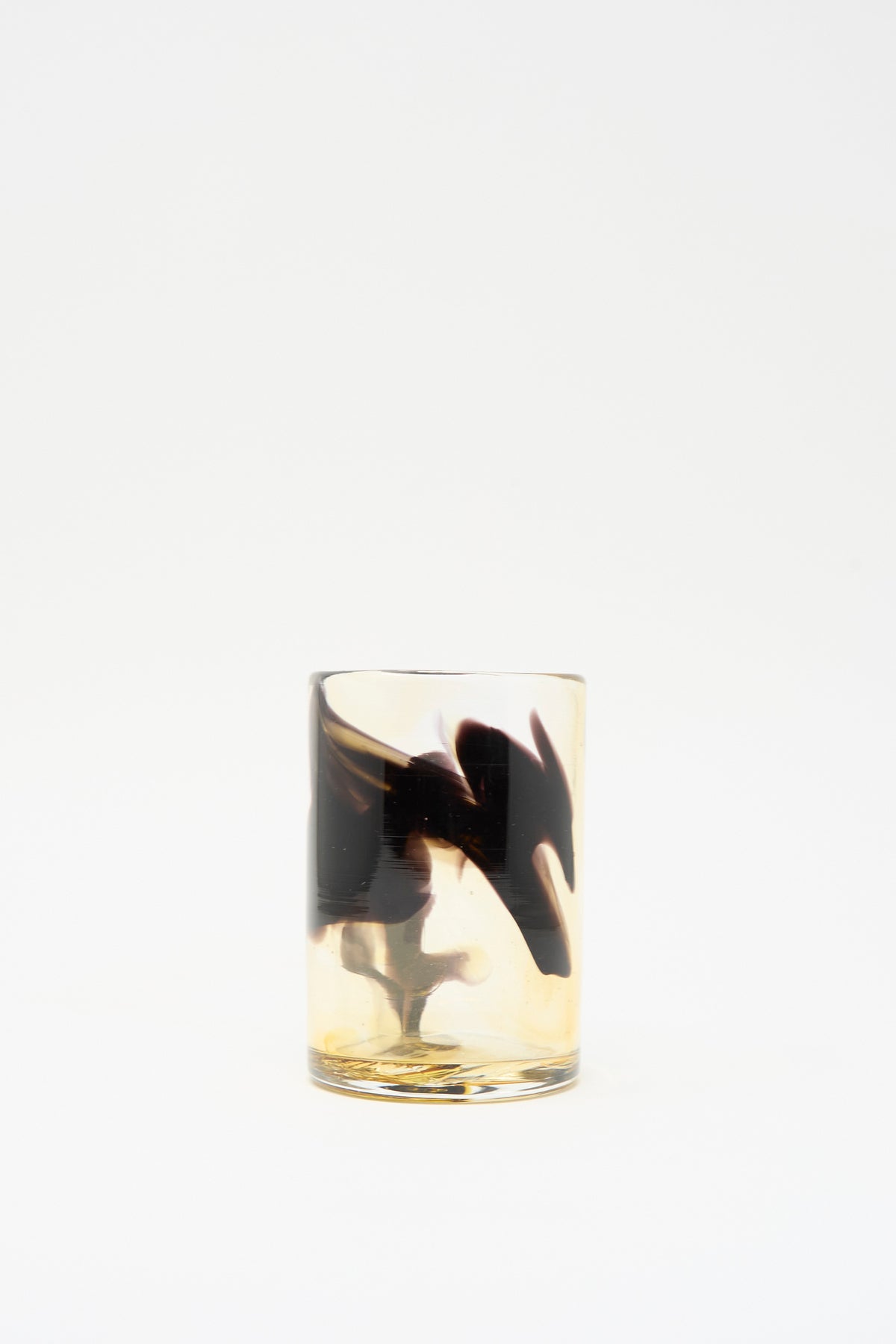 Gone Hand Dyed Fumé Glass cylindrical tumbler with swirling amber and dark brown smoky patterns.