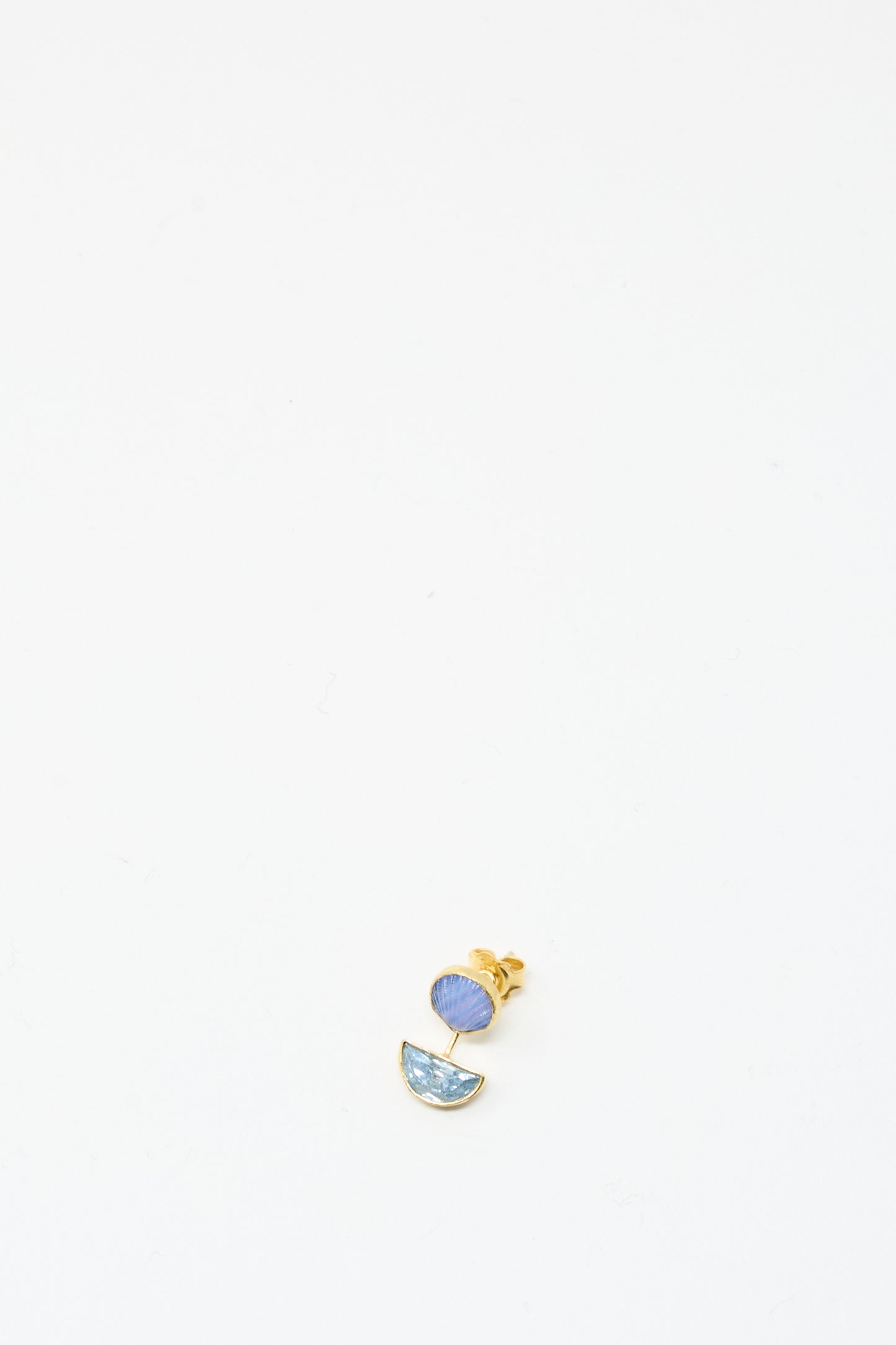 The Detachable Drop Earring in Blue Shell by Grainne Morton is a handmade 18K gold plated stud, showcasing a small blue circle above a light blue semicircle, presented on a plain white background.