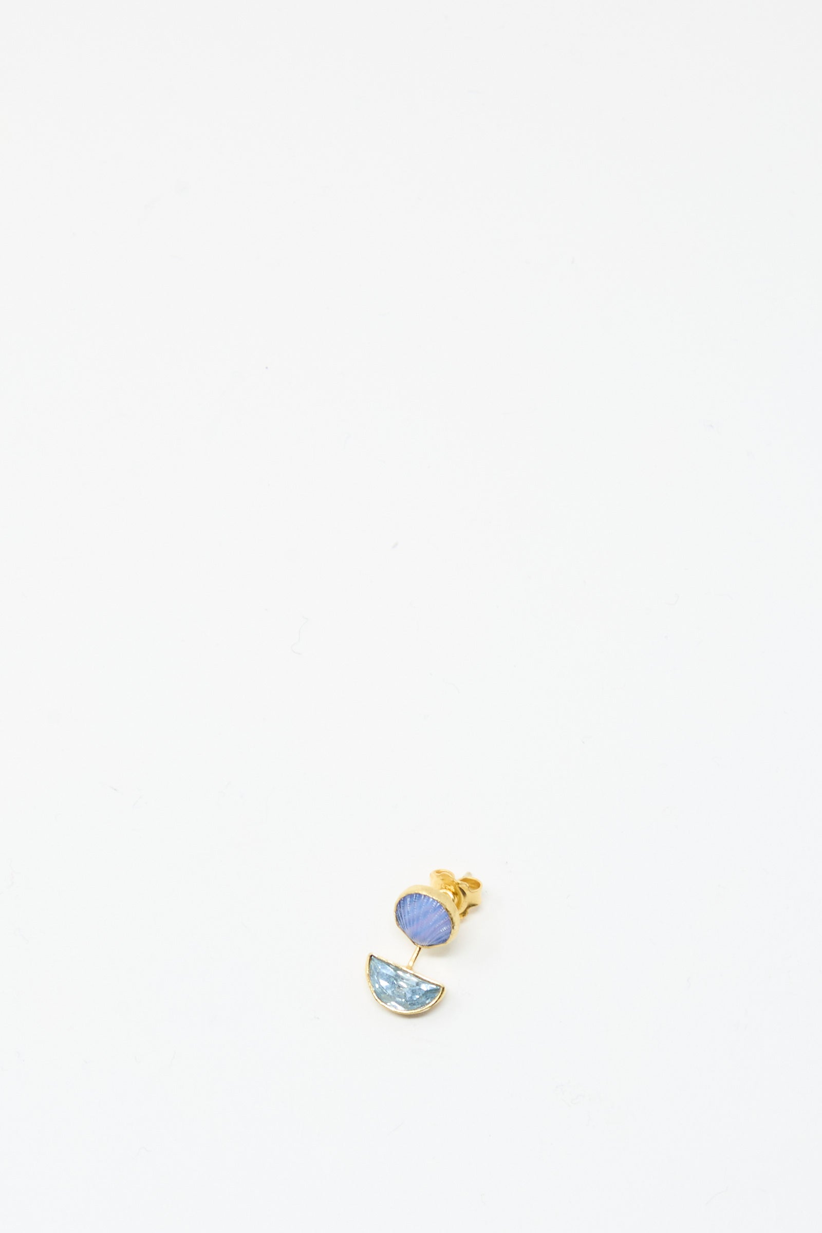 The Detachable Drop Earring in Blue Shell by Grainne Morton is a handmade 18K gold plated stud, showcasing a small blue circle above a light blue semicircle, presented on a plain white background.