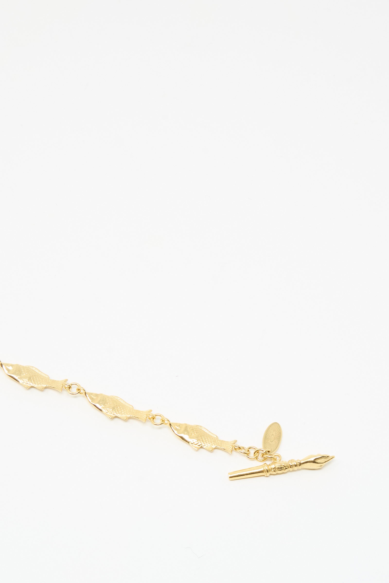 The Grainne Morton Fish Bracelet is a gold-plated silver chain with leaf-shaped links and a toggle clasp, handmade in Edinburgh and shown on a plain white background.