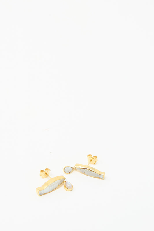 Grainne Morton's Fish Drop Earrings feature fish shapes and small white stones, made from gold-plated silver, presented on a plain white background.