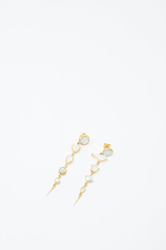 The Grainne Morton Five Charm with Victorian Drop Earrings feature gold plating, geometric shapes, and small clear stones, presented against a plain white background.