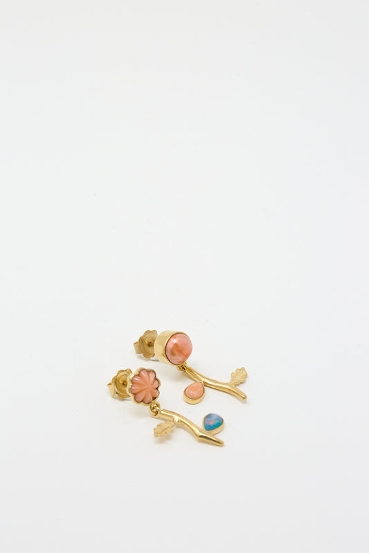 A pair of Grainne Morton Flower Drop Earrings, 18K gold-plated silver stud earrings with pink and blue stones.