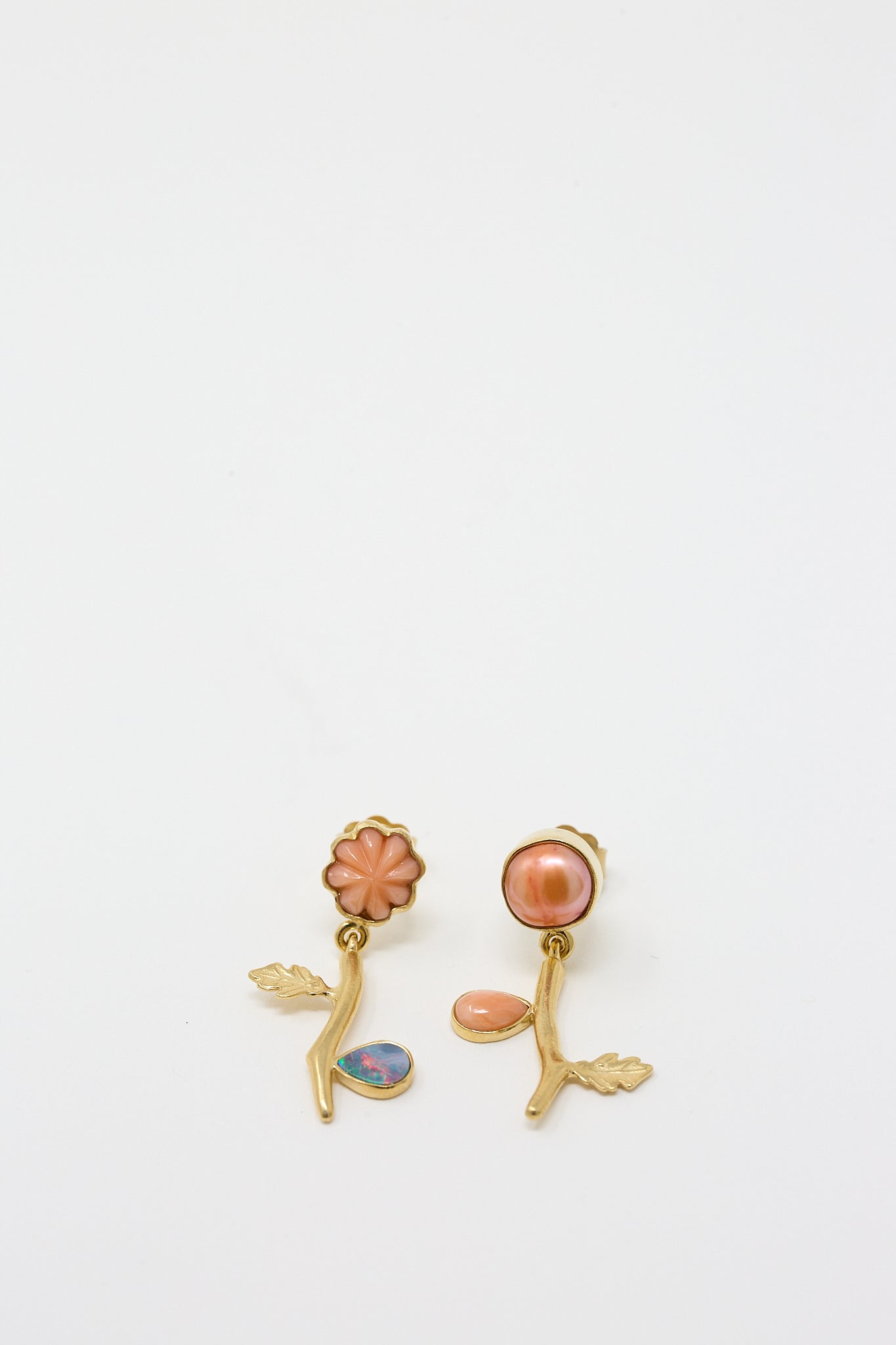 A pair of Grainne Morton Flower Drop Earrings with coral and opal stones.
