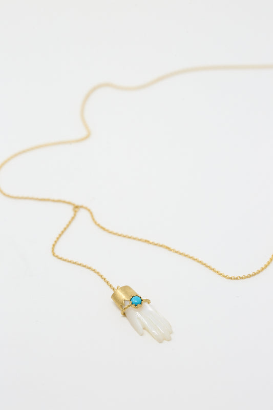 A Grainne Morton Hand Lariat with Bracelet Necklace with a Mother of Pearl stone on it.