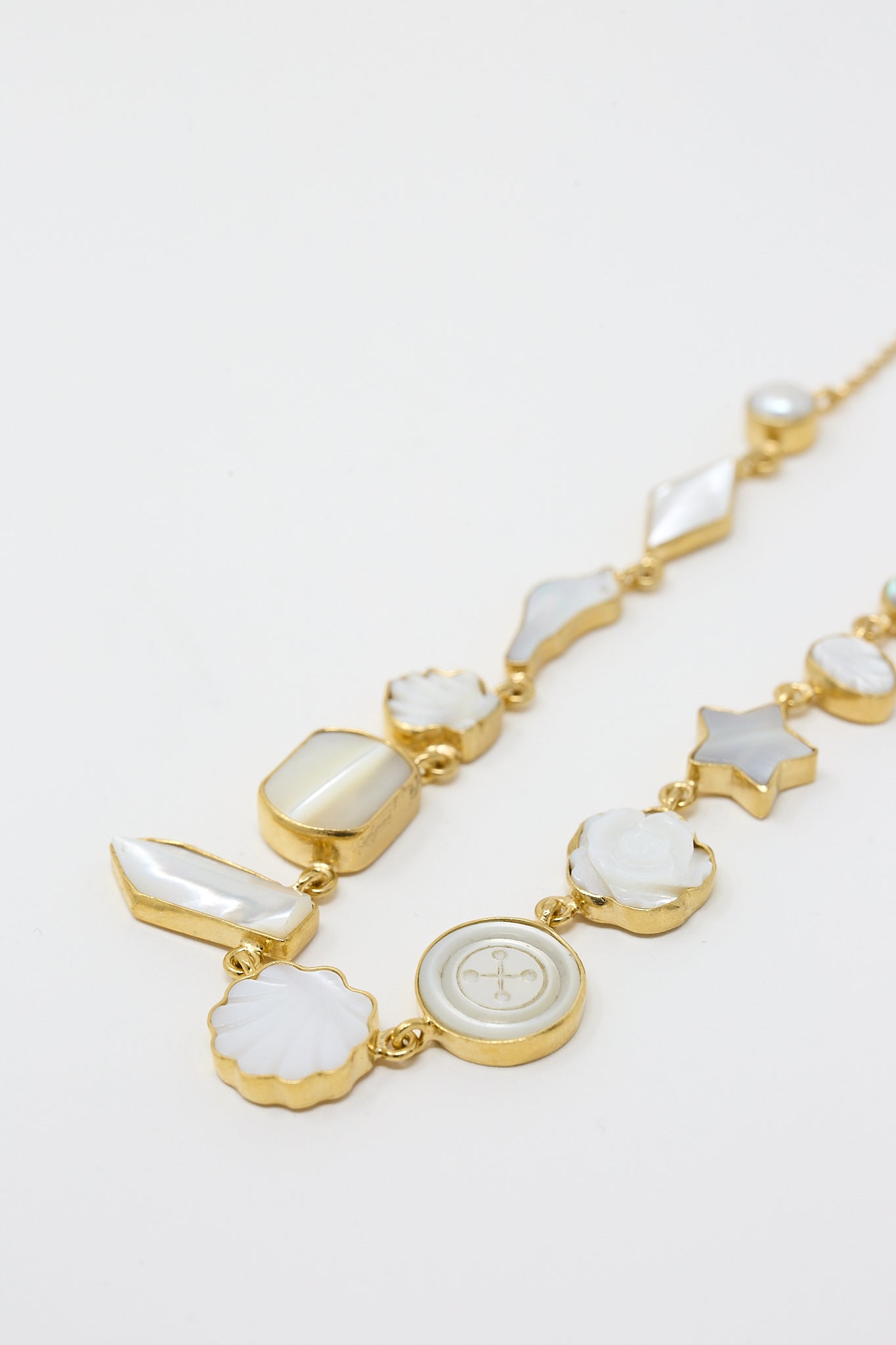 A gold-plated Pearl and Shell Necklace with a Mother of Pearl charm by Grainne Morton.