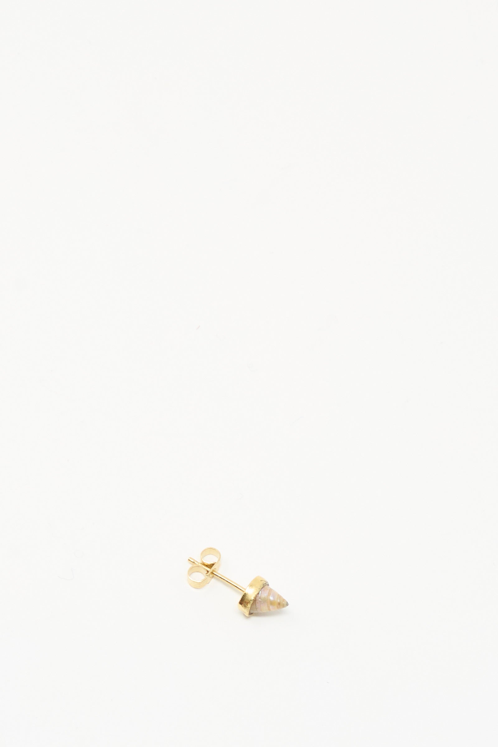 A single handmade Stud Earring in Shell by Grainne Morton, featuring a small conical stone and crafted from ethically sourced materials, is displayed on a plain white background.