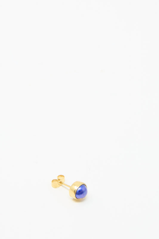 The Grainne Morton Stud Earring in Blue Pearl,  set on a white background, is made  from 18k gold-plated silver with a blue stone. 