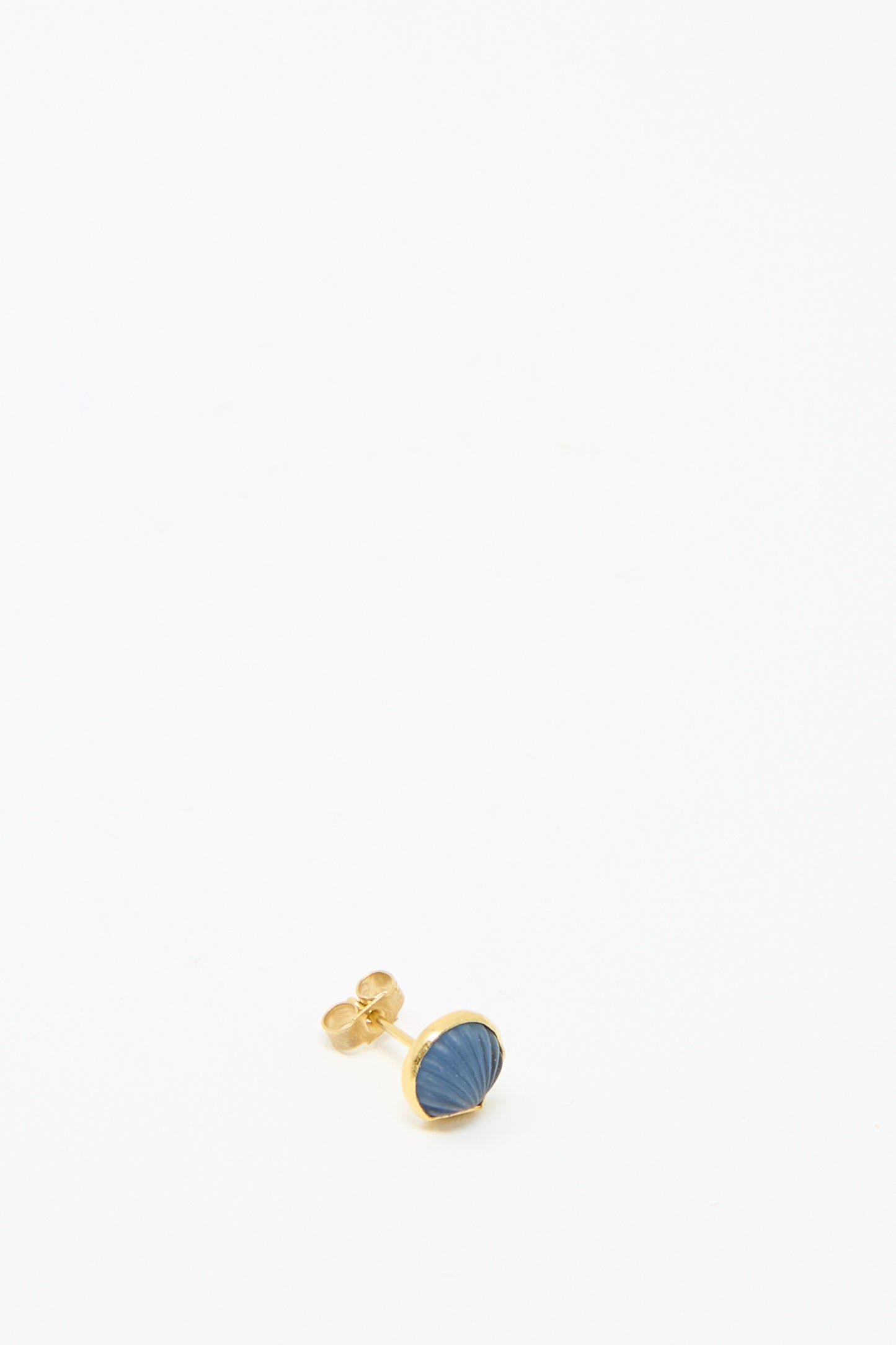 The Grainne Morton Stud Earring in Blue Shell showcases an 18k gold-plated design featuring a blue, textured oval stone on a pristine white backdrop.