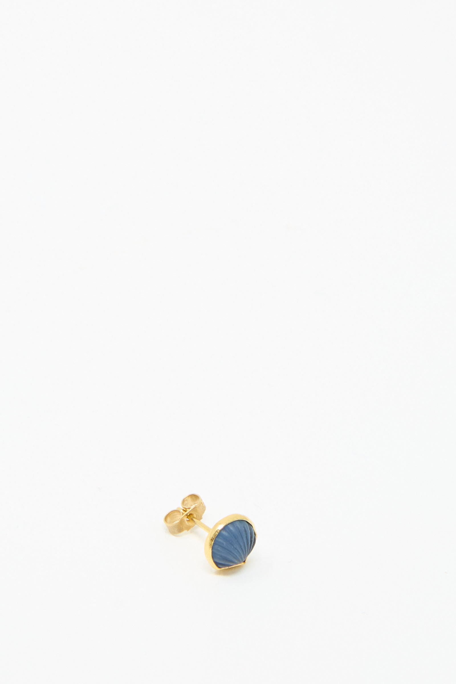 The Grainne Morton Stud Earring in Blue Shell showcases an 18k gold-plated design featuring a blue, textured oval stone on a pristine white backdrop.