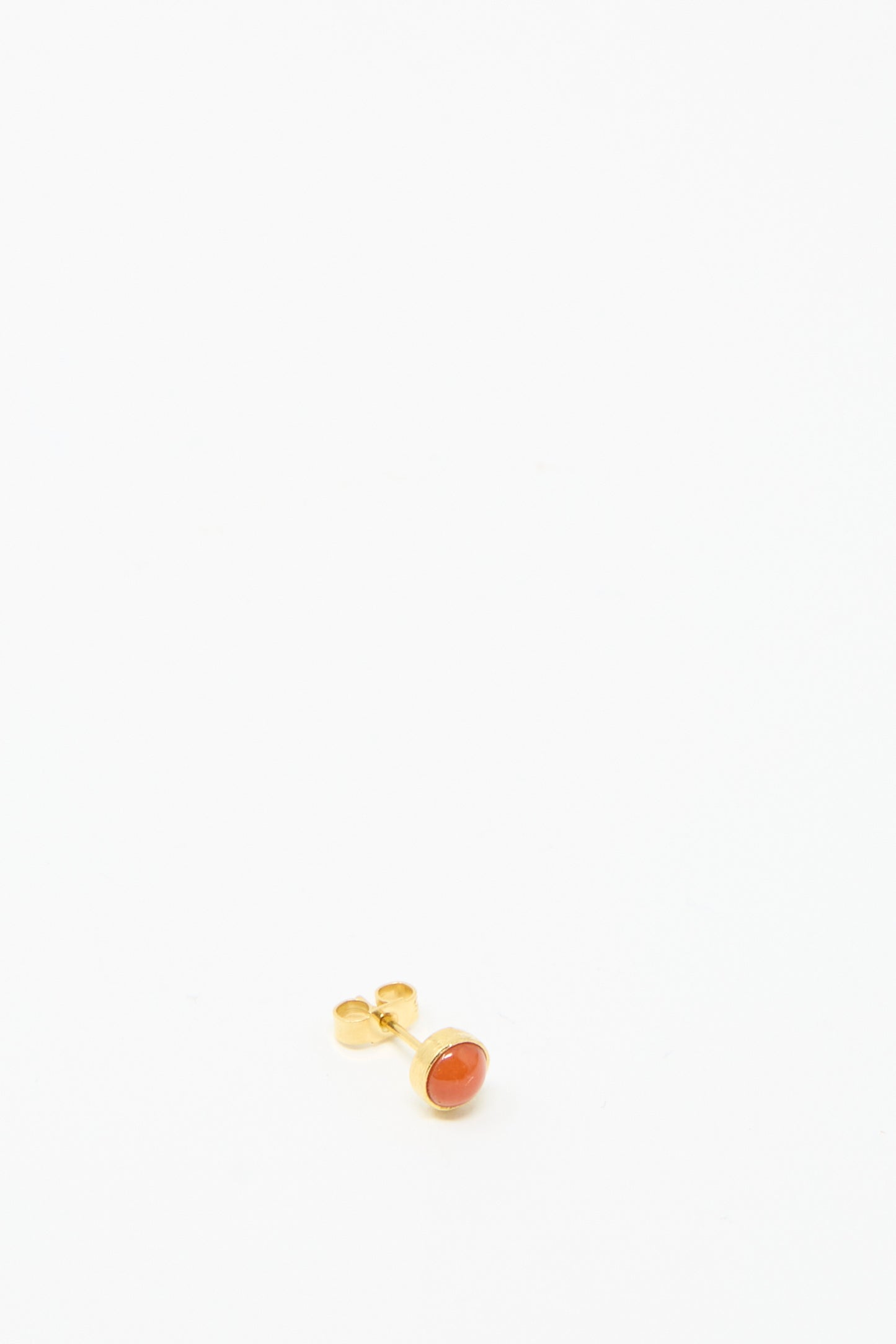 The Grainne Morton Stud Earring in Coral, made of 18k gold-plated silver and featuring an orange gemstone, is showcased on a simple white background.