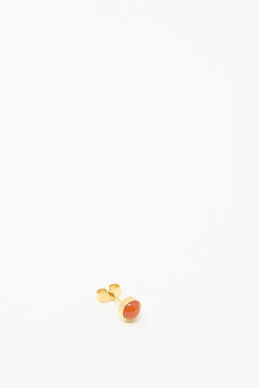 The Grainne Morton Stud Earring in Coral, made of 18k gold-plated silver and featuring an orange gemstone, is showcased on a simple white background.