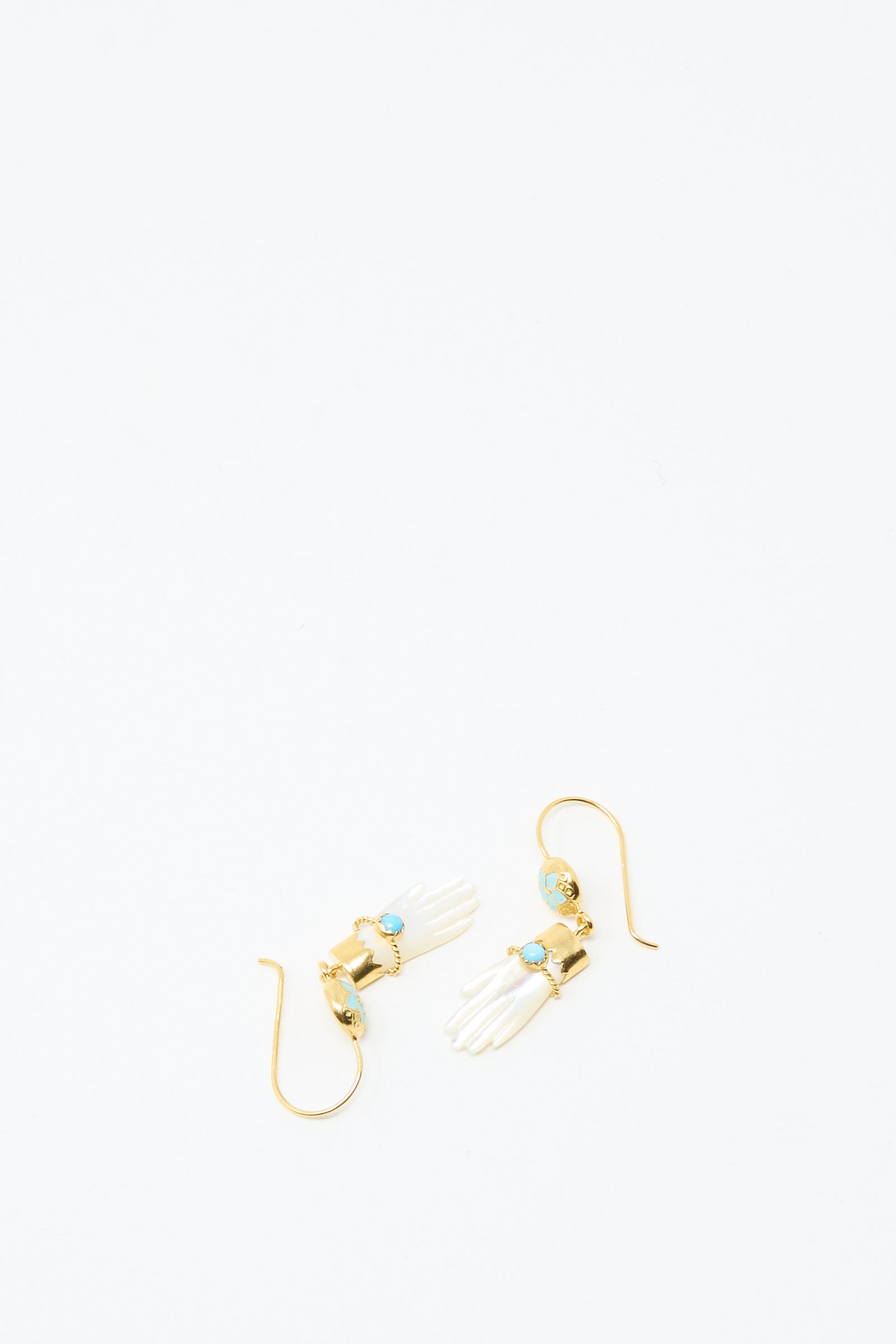 Grainne Morton Hand Hooks with Bracelet Earrings: 18K gold plated earrings in the shape of hands, each featuring a turquoise stone and ornate gold detailing, shown on a white background.
