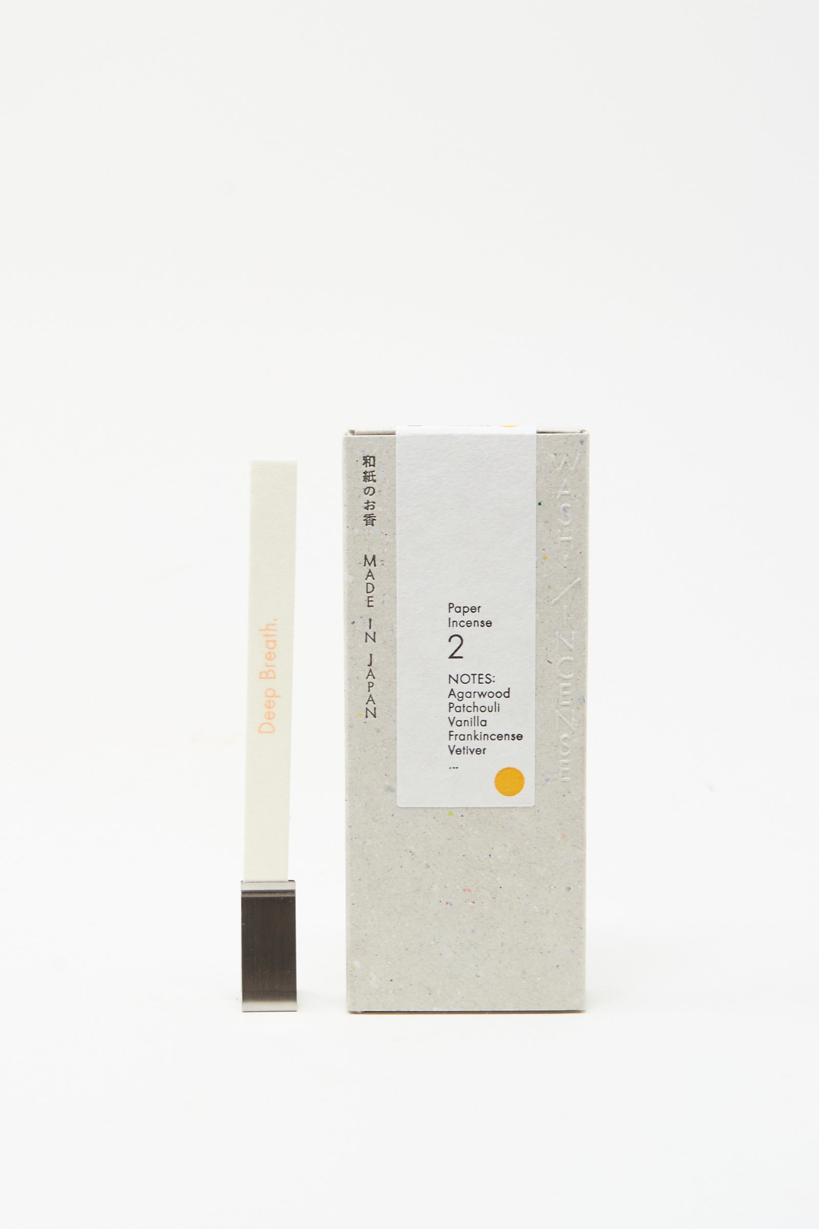 Morihata's "Washi Paper Incense Strips in Elegant Agarwood" features delicate strips with notes of agarwood, vanilla, frankincense, and vetiver, accompanied by a metal holder.