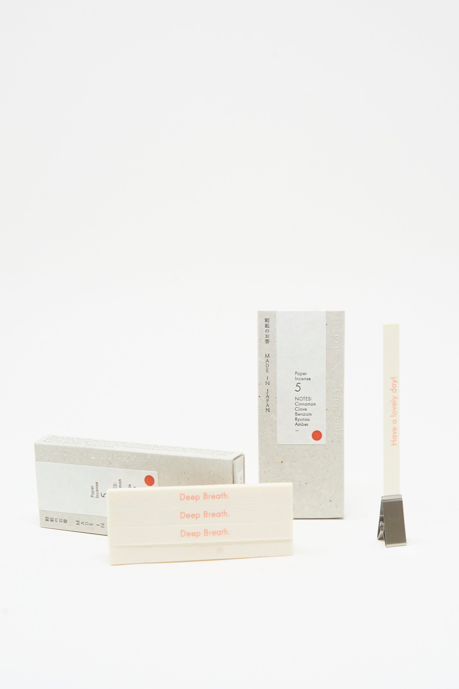 Morihata’s Washi Paper Incense Strips in Smoky Comfort come with a minimal holder and refined packaging labeled "Deep Breath," all set against a clean white background. Crafted in Japan for an elegant, minimalist touch.