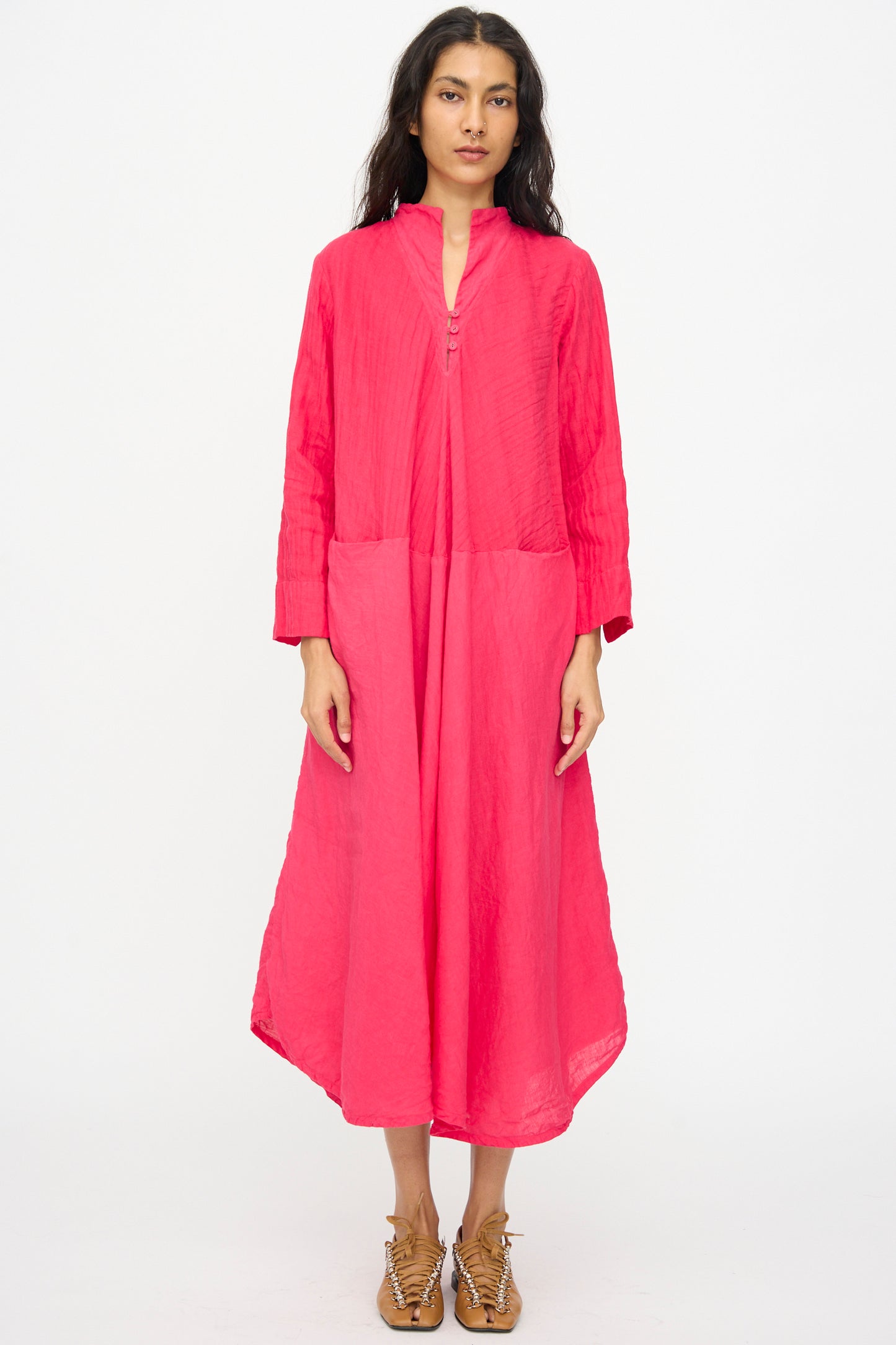 A woman faces forward wearing the Hallelujah Cotton Linen Robe de Femme de Chambre in cherry red with tan lace-up shoes, set against a plain white background.