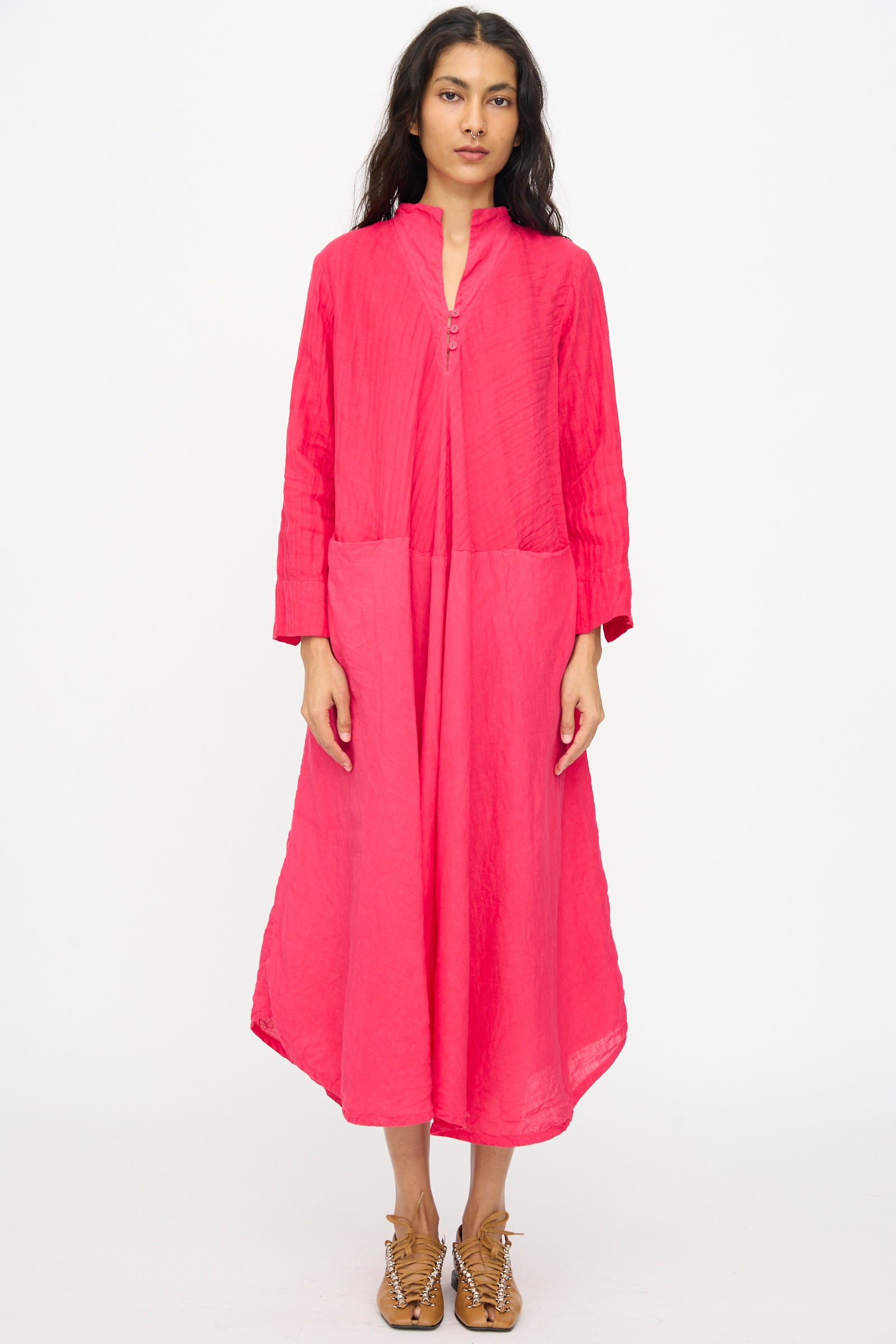 A woman faces forward wearing the Hallelujah Cotton Linen Robe de Femme de Chambre in cherry red with tan lace-up shoes, set against a plain white background.