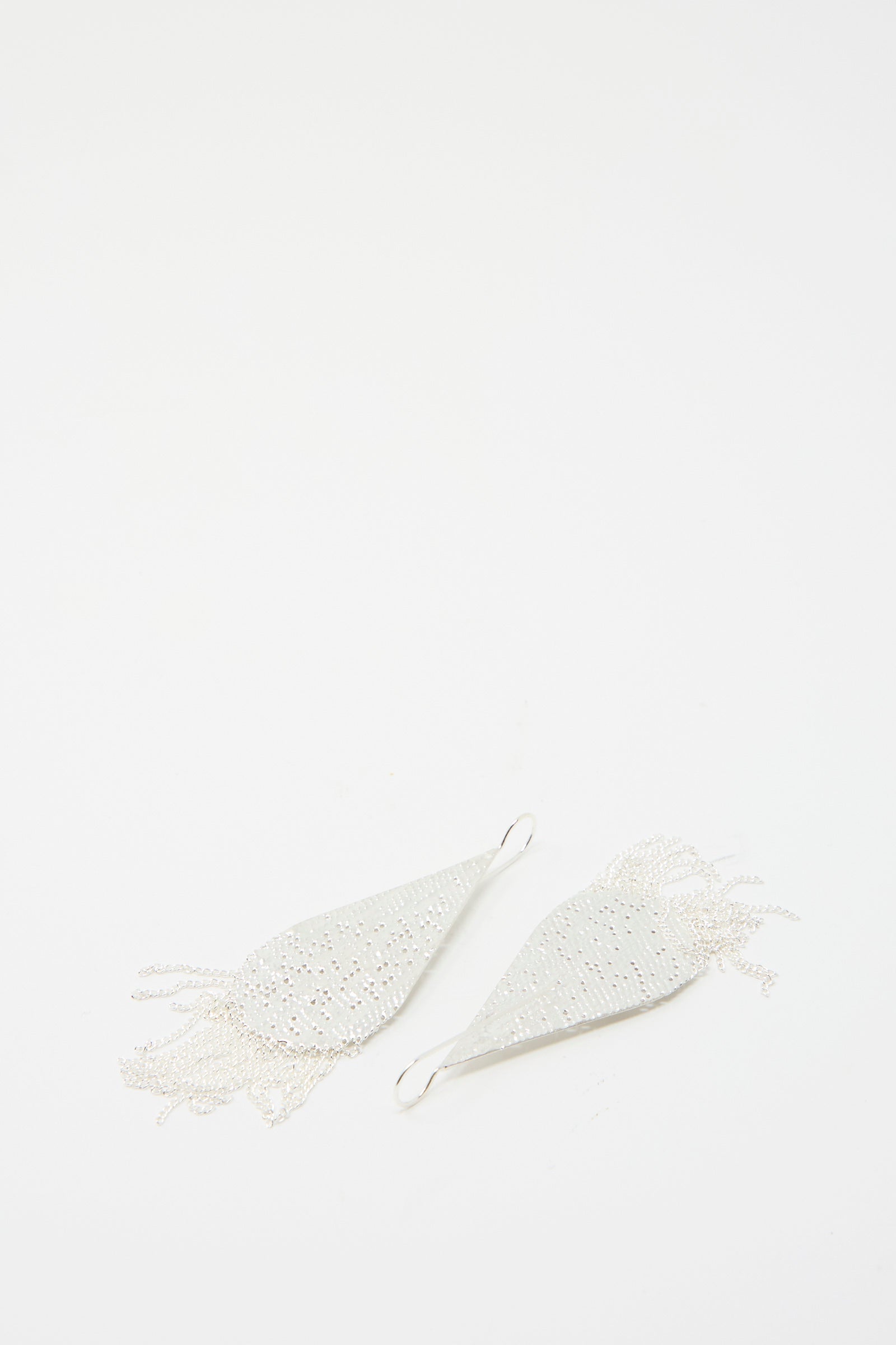 The Drip Earrings in Silver by Hannah Keefe, handcrafted in California with a silver chain fringe detail, are displayed against a white background.