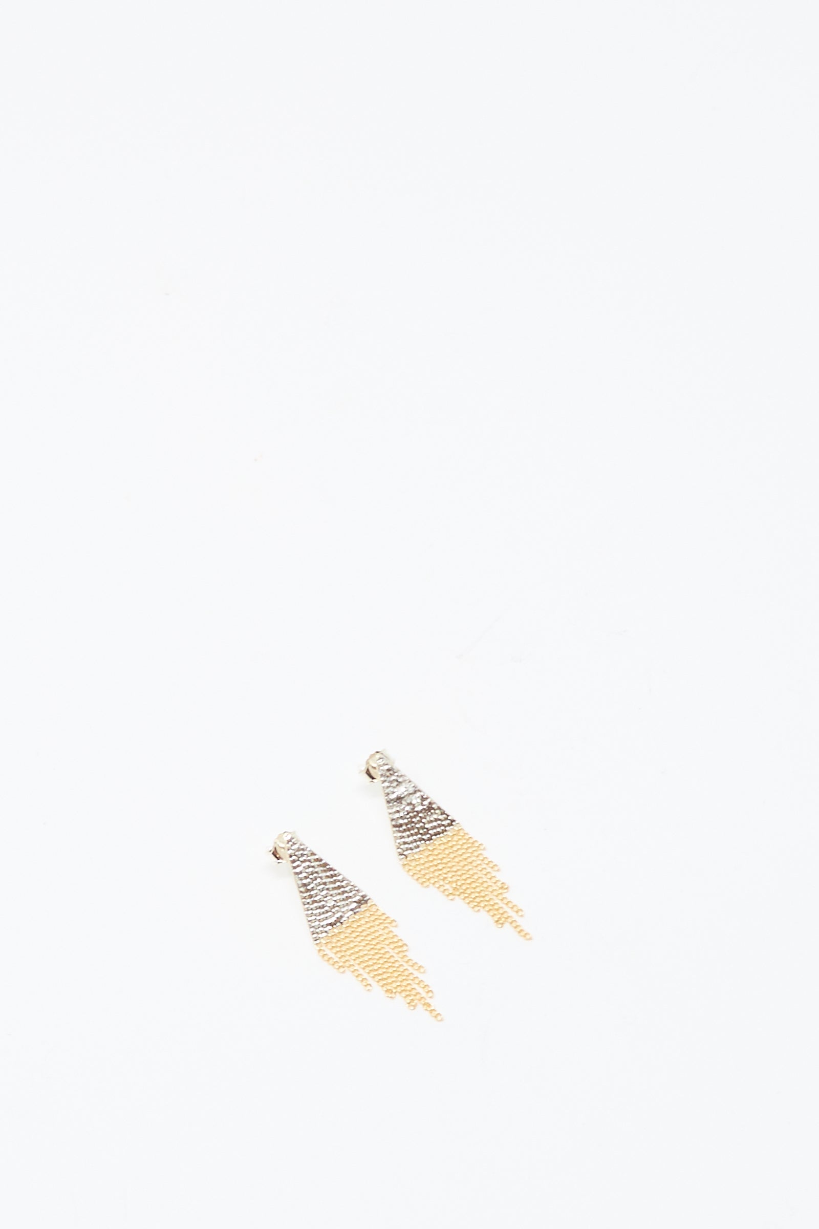The Lil Triangle Studs in Brass and Silver by Hannah Keefe are handmade in Los Angeles and feature silver and gold chain fringe with a triangular hook, shown on a plain white background.