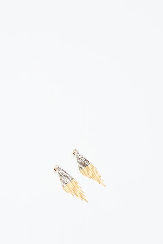 The Lil Triangle Studs in Brass and Silver by Hannah Keefe are handmade in Los Angeles and feature silver and gold chain fringe with a triangular hook, shown on a plain white background.