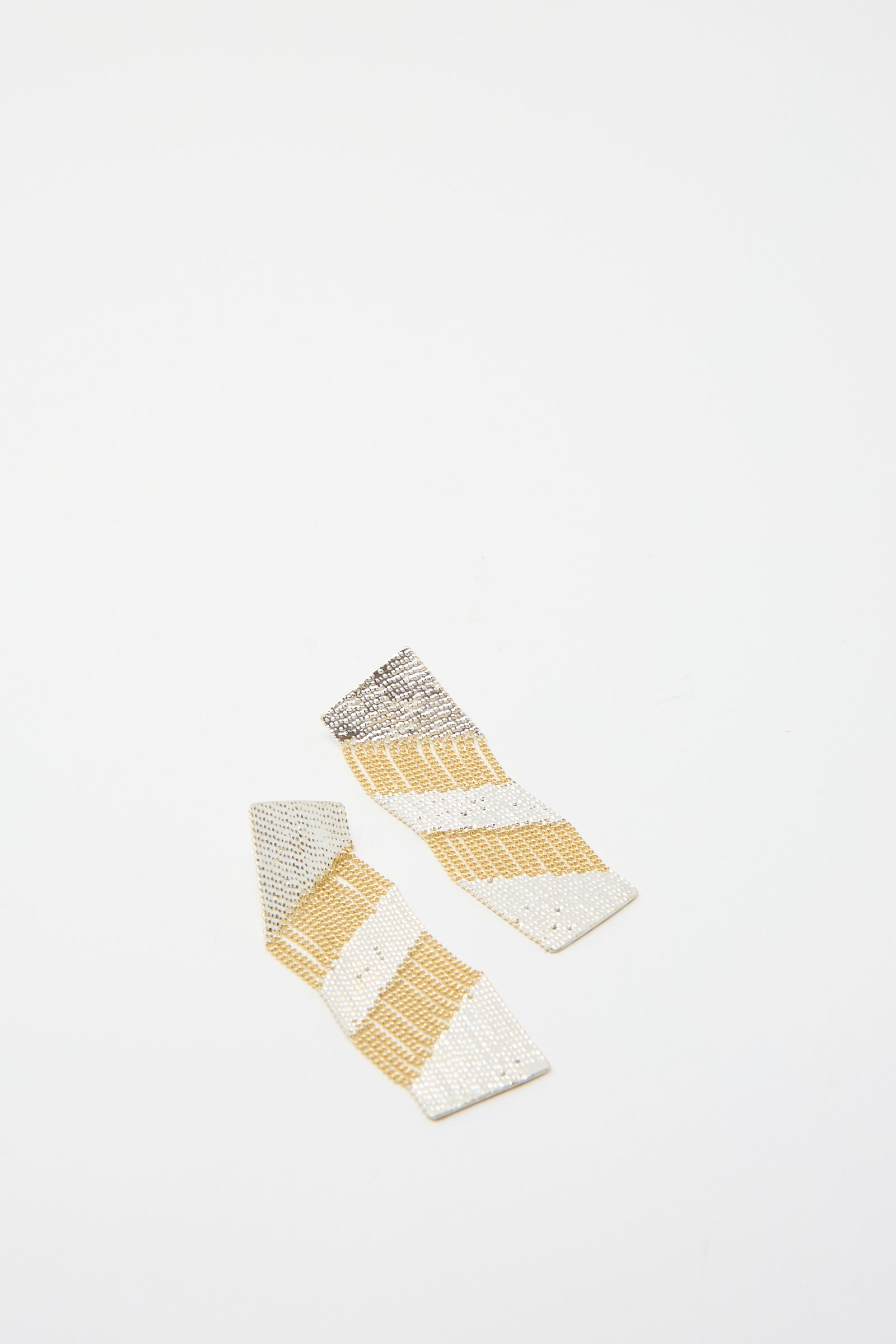 The Sunny Earrings in Brass and Silver by Hannah Keefe showcase a handmade brass and silver striped pattern presented against a plain white background.