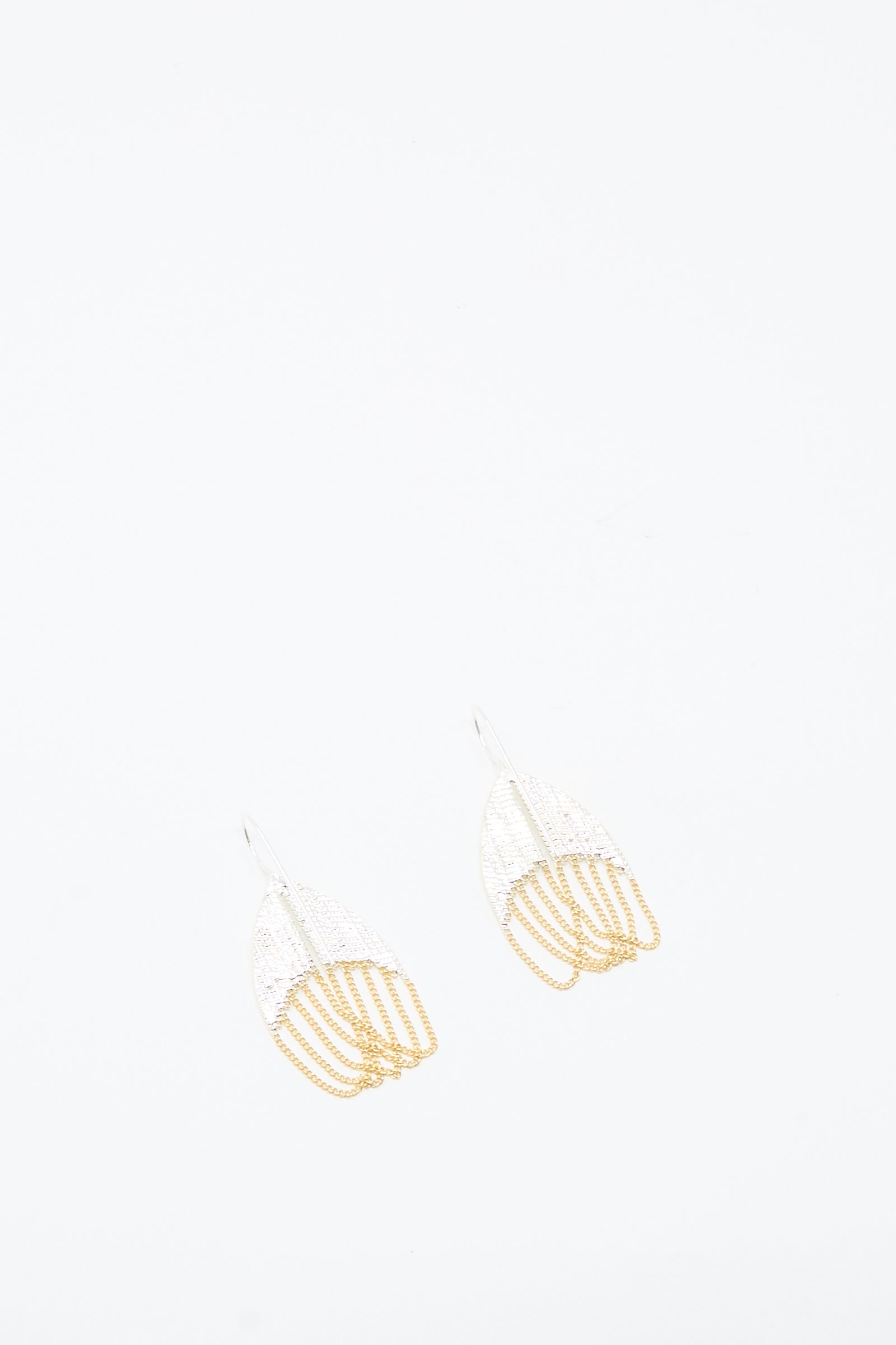 The Scarab Earrings in Brass and Silver by Hannah Keefe feature a delicate, abstract fan-like design shown on a plain white background.