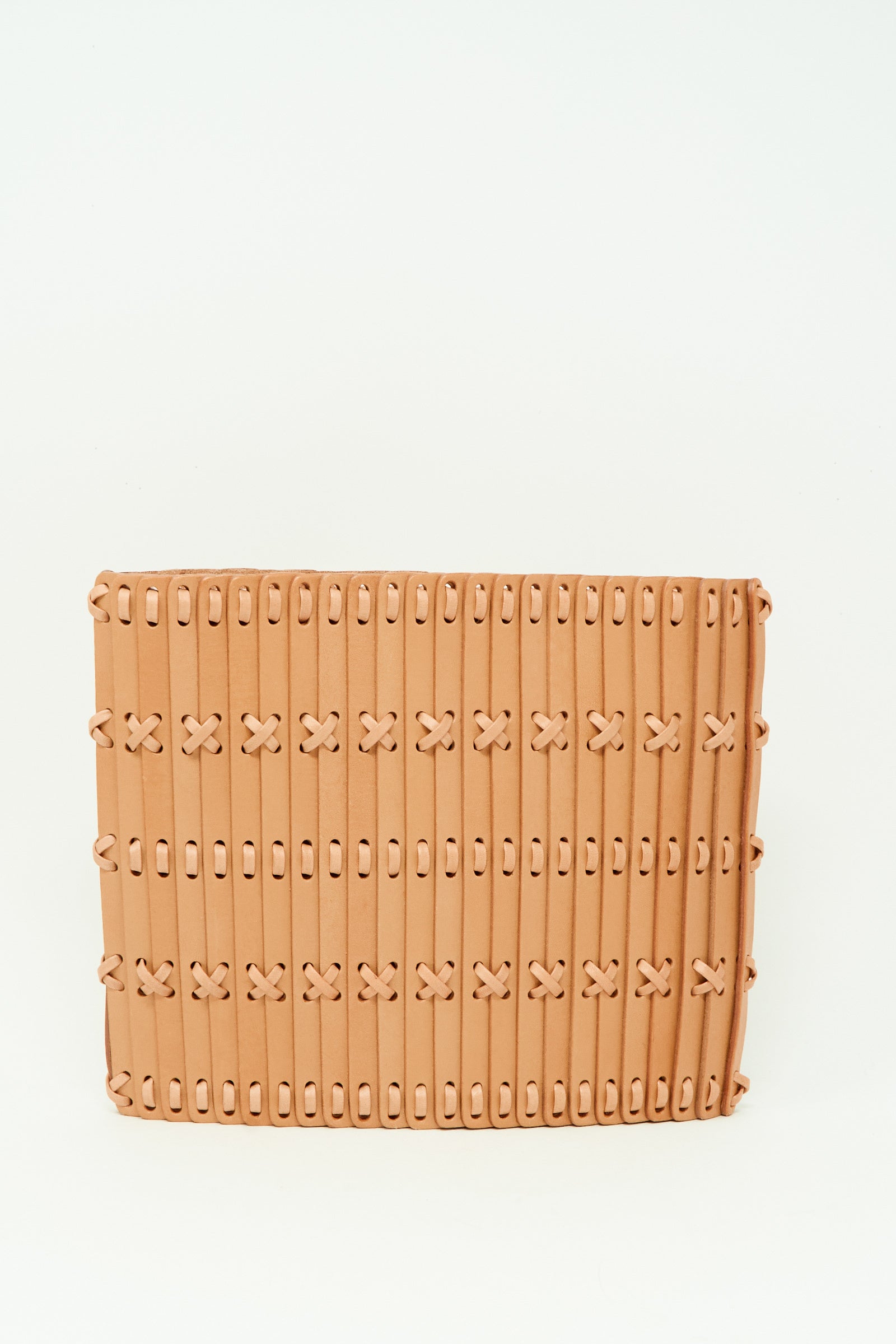 The Hatori Leather Crossbody 48 in Natural with Tanned Lace is a handcrafted rectangular tan woven clutch with horizontal strips and cross-stitch details, shown on a plain white background.
