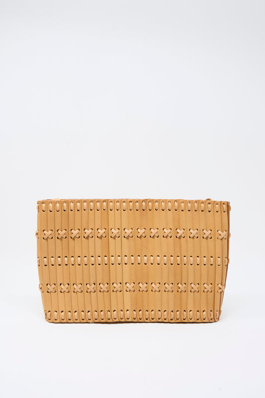 The Hatori Leather Shoulder 60 Bag in Natural with Tan Lacing is a rectangular clutch meticulously handcrafted from vegetable-tanned leather, featuring vertical slats and crisscross lacing details, showcased against a plain white background.