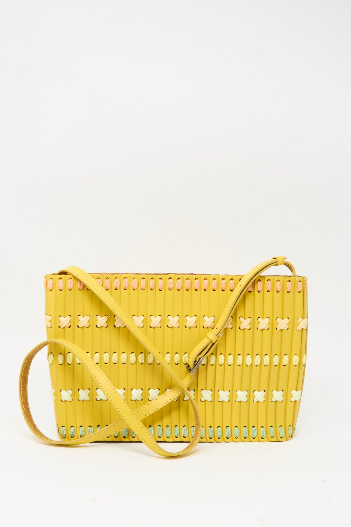 Yellow Leather Shoulder 60 Bag Artist Edition with Holly Coulis featuring a perforated design laced with multicolored, crisscrossed stitching and an adjustable shoulder strap.