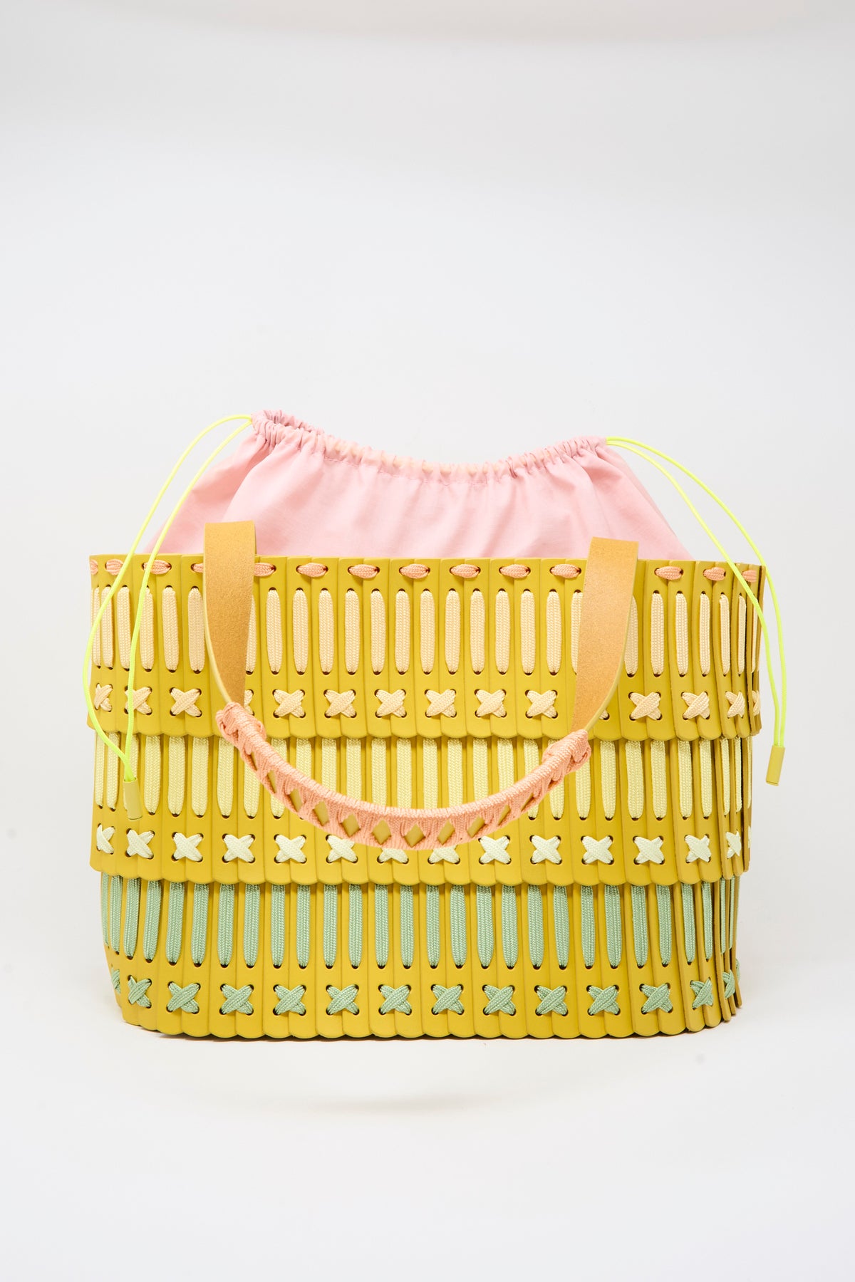 Hatori Leather Tote 198 Artist Edition with Holly Coulis in Yellow, a handcrafted woven tote bag featuring a pink drawstring interior and two shoulder straps.