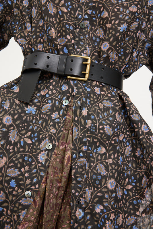 Close-up of a floral Ichi Antiquités dress with a Black Leather Belt.