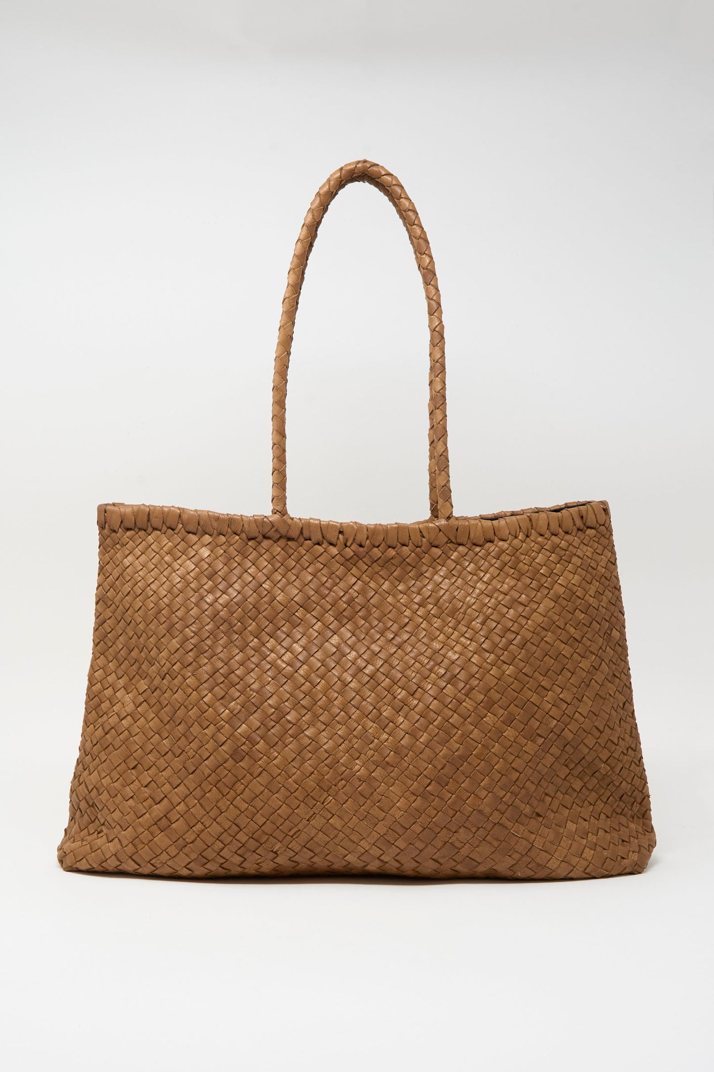 The Ichi Antiquités Leather Tote Bag in Brown features a woven design and two handles, shown against a plain white background.