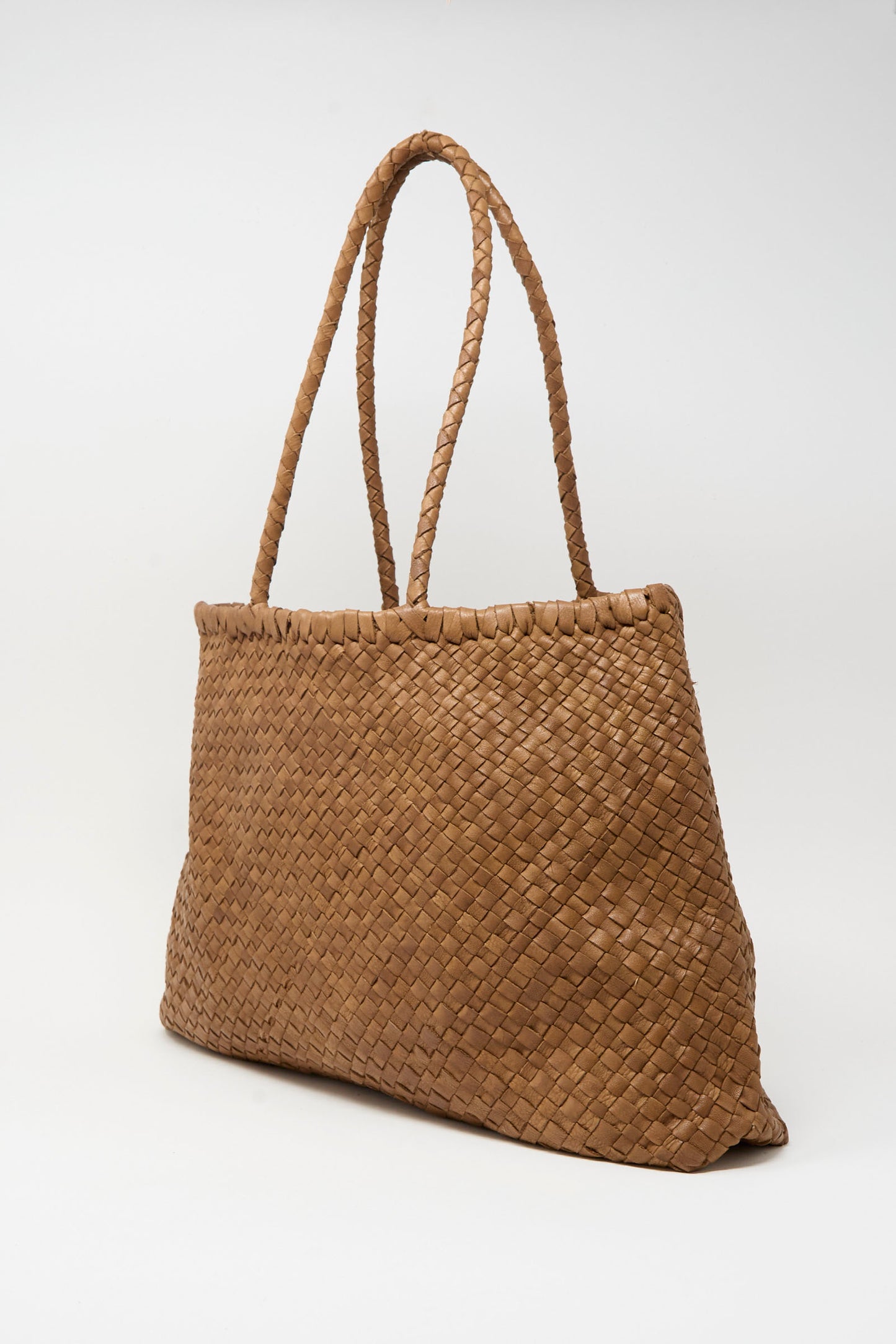 The Leather Tote Bag in Brown by Ichi Antiquités features a woven cow leather design with double braided shoulder straps, displayed against a plain white background.
