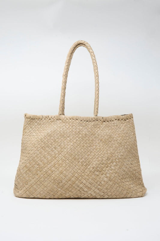 The Ichi Antiquités Leather Tote Bag in Greige features braided handles and is displayed against a plain white background.