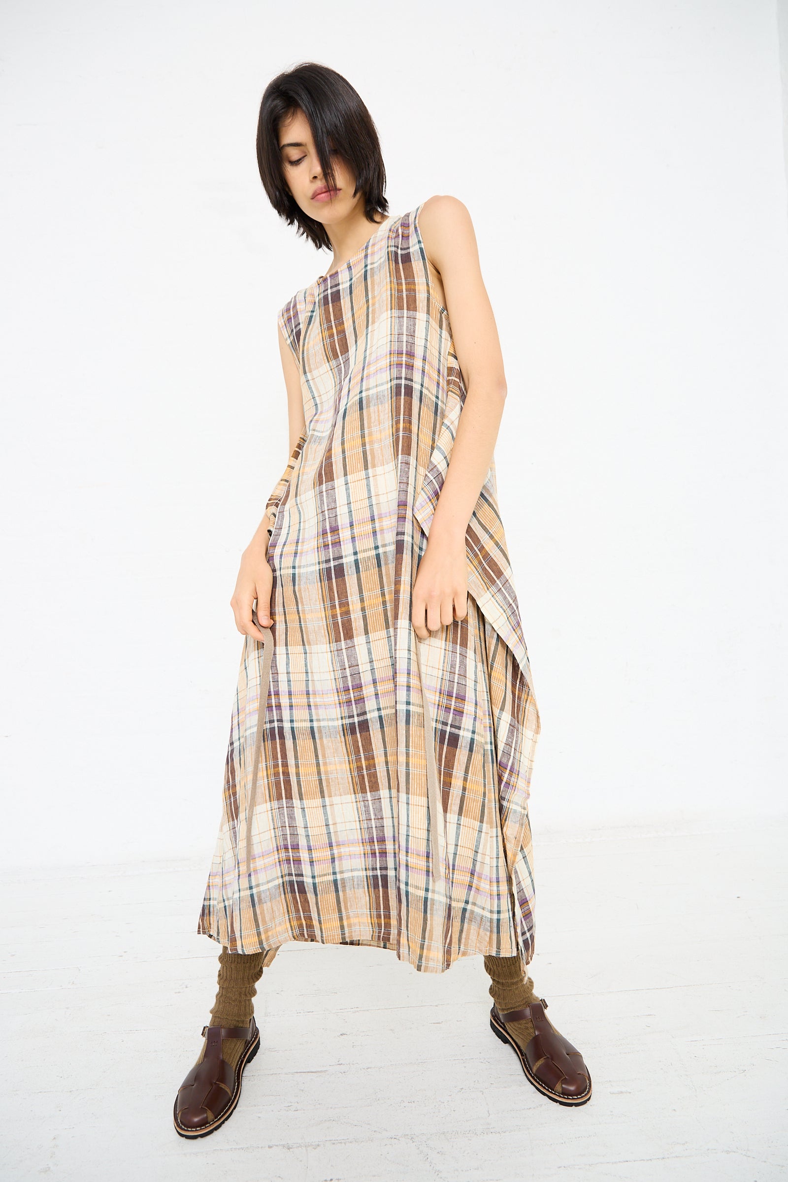 Person in the Linen Check Dress in Beige by Ichi Antiquités standing against a plain white background, wearing brown socks and sandals.