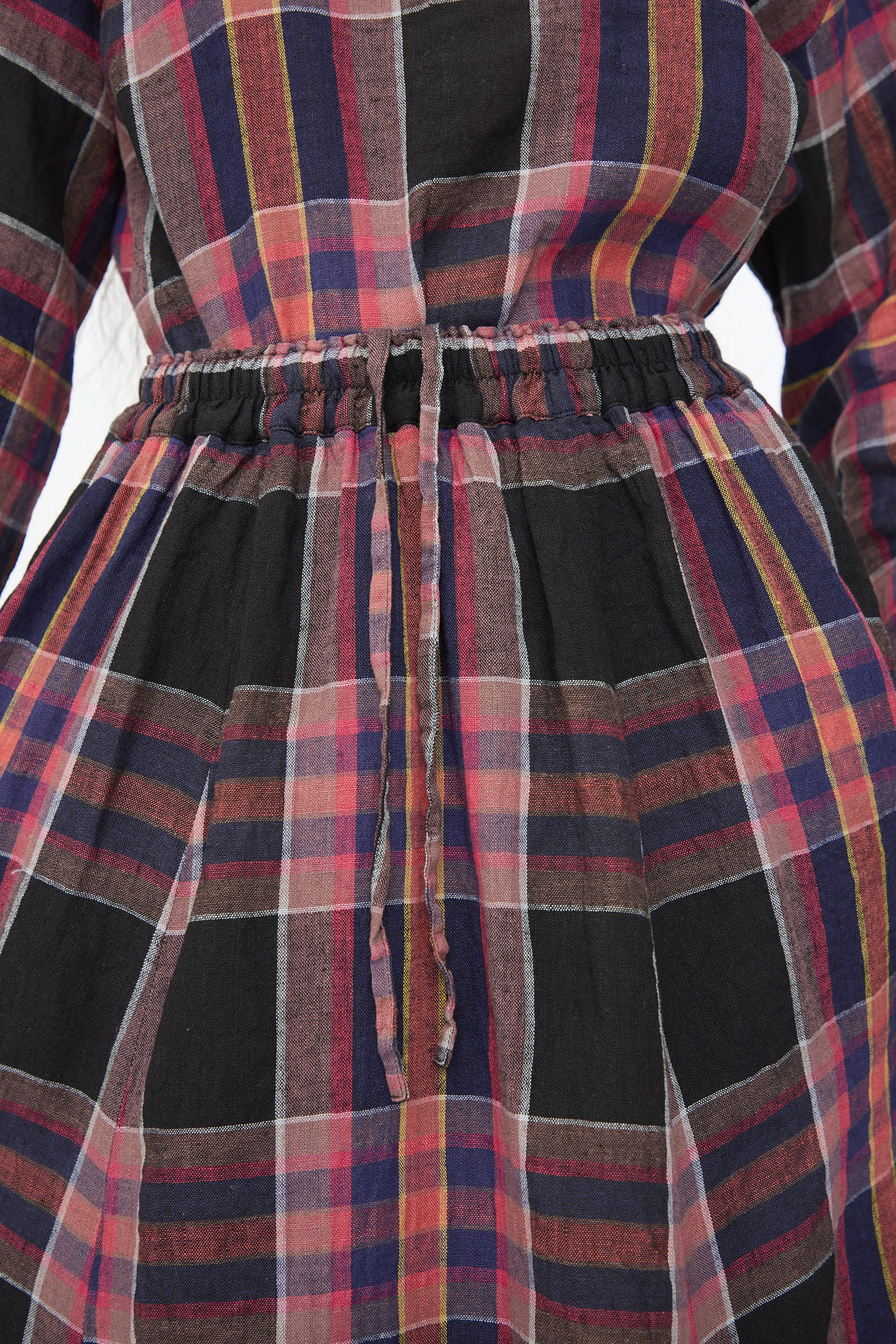 Close-up of the Linen Check Skirt in Black by Ichi Antiquités, featuring plaid red, black, and blue stripes, an A-line silhouette, cinched elastic waistband with fabric drawstring, crafted from a soft linen-cotton blend.