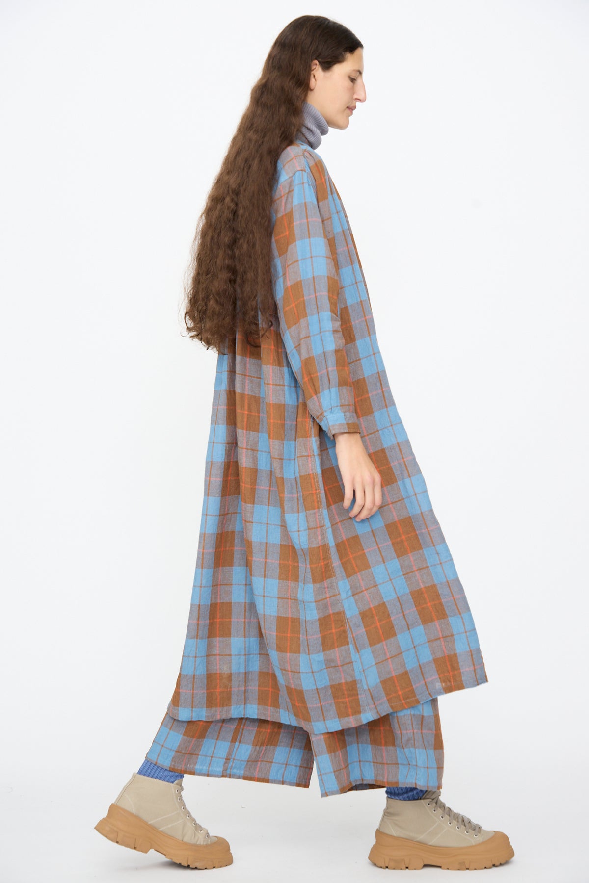 A person wearing an Ichi Antiquités Linen Cotton Check Dress in Blue over matching wide-leg trousers and beige platform sneakers.