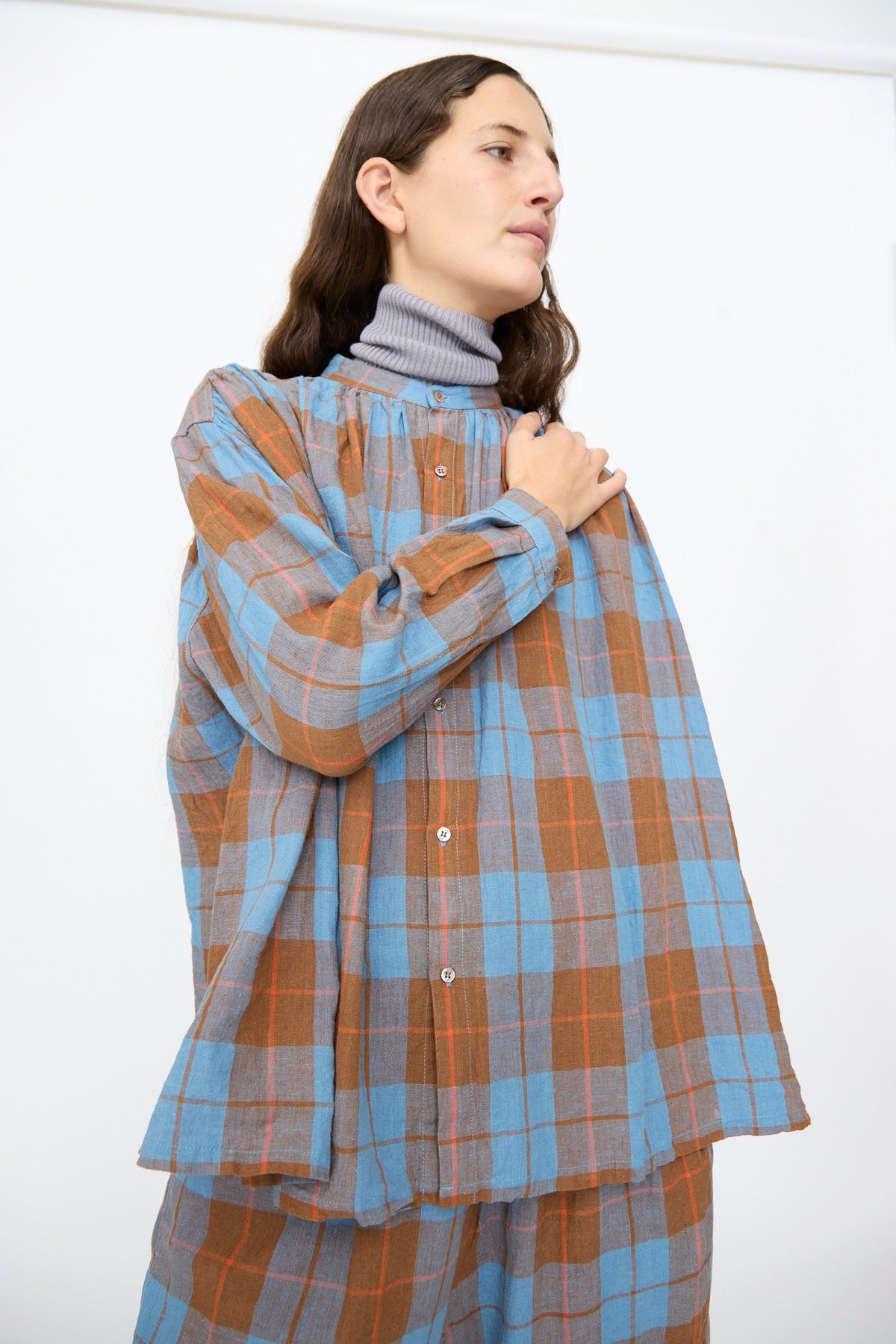 Ichi Antiquités Linen Cotton Check Shirt in Blue worn over a grey turtleneck.