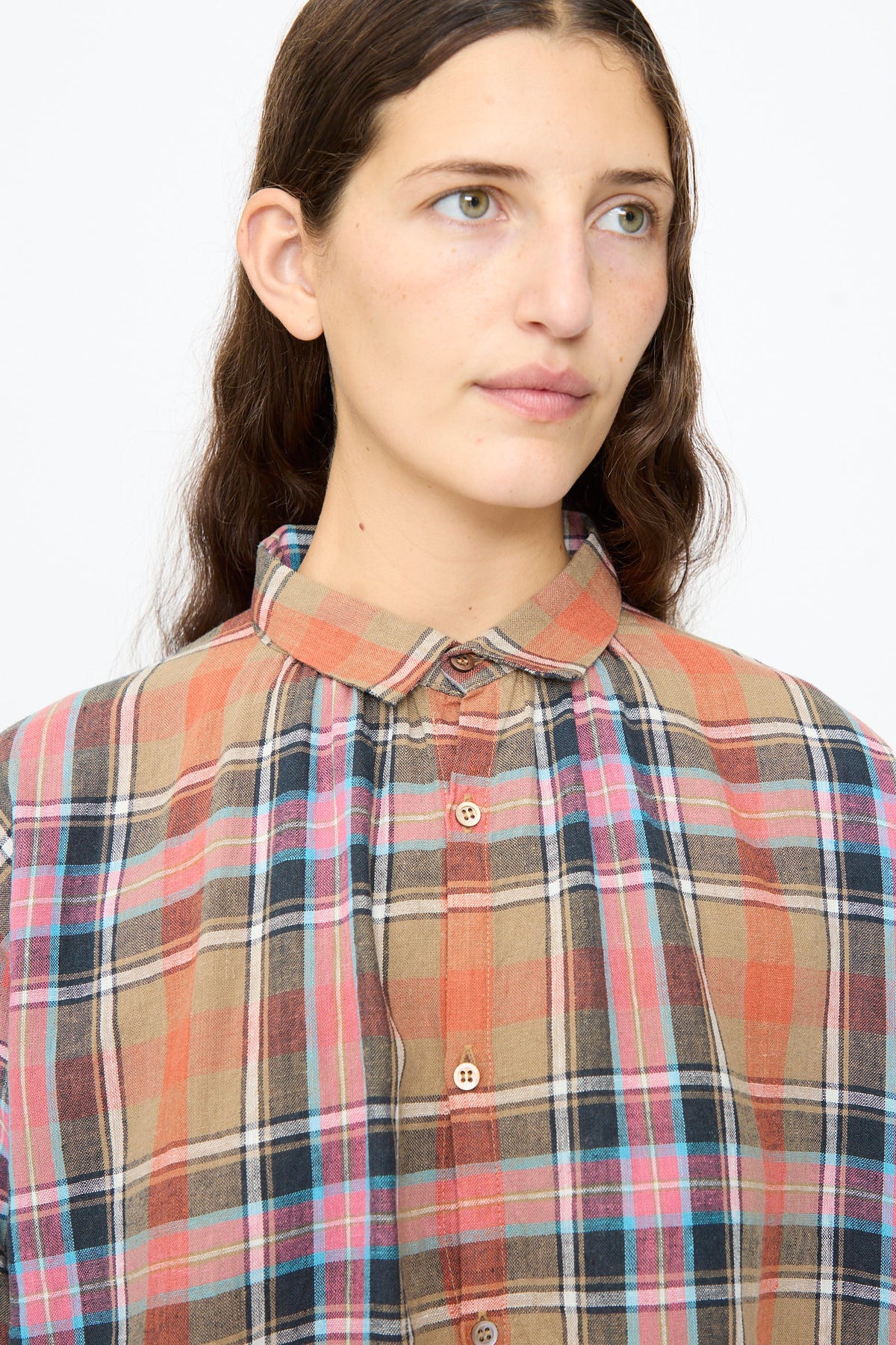 A person wearing an Ichi Antiquités Linen Cotton Tartan Check Shirt in beige, featuring a red and blue plaid pattern.
