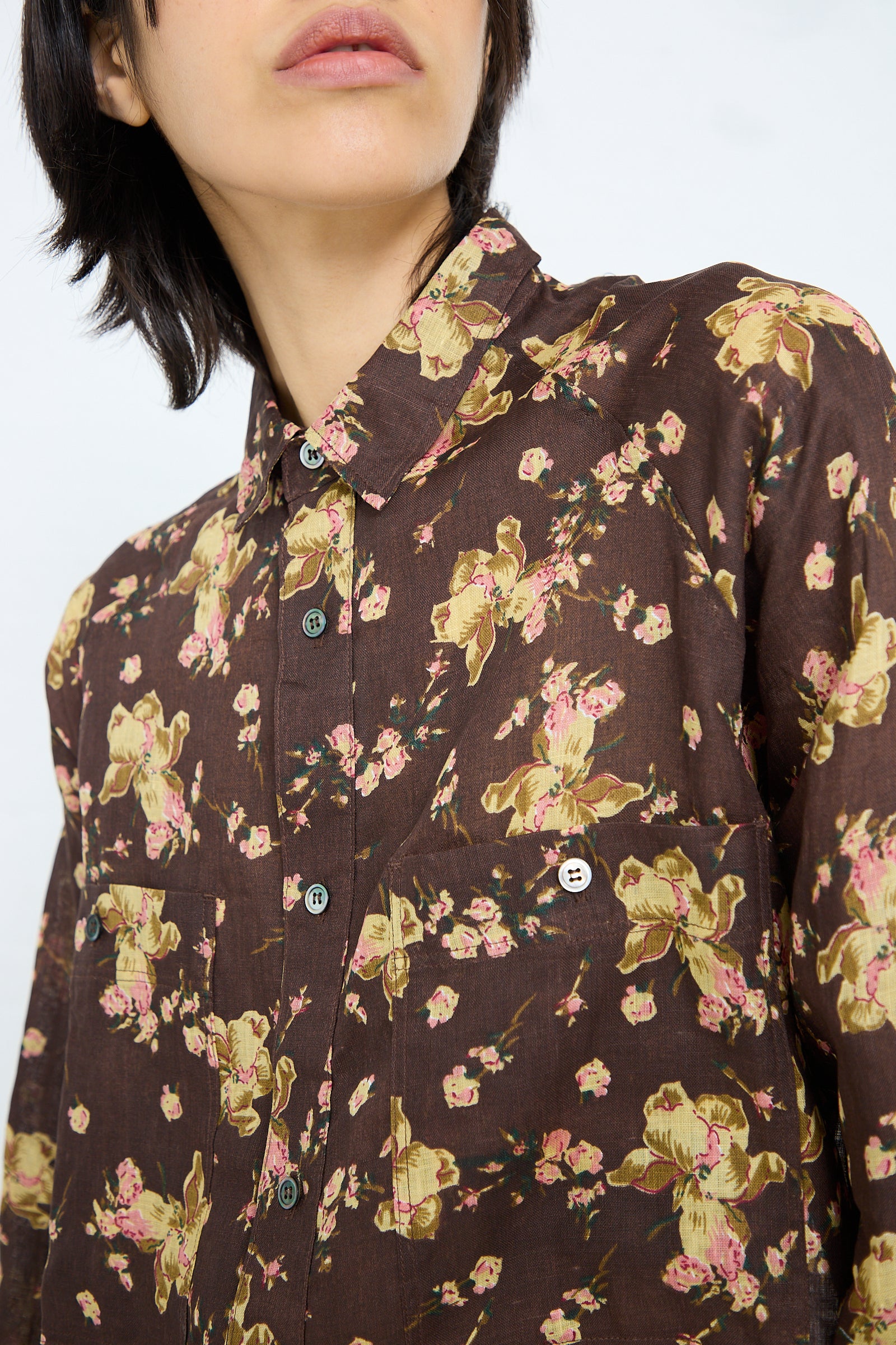 A person wearing the Ichi Antiquités Linen Flower Print Dress in Brown.