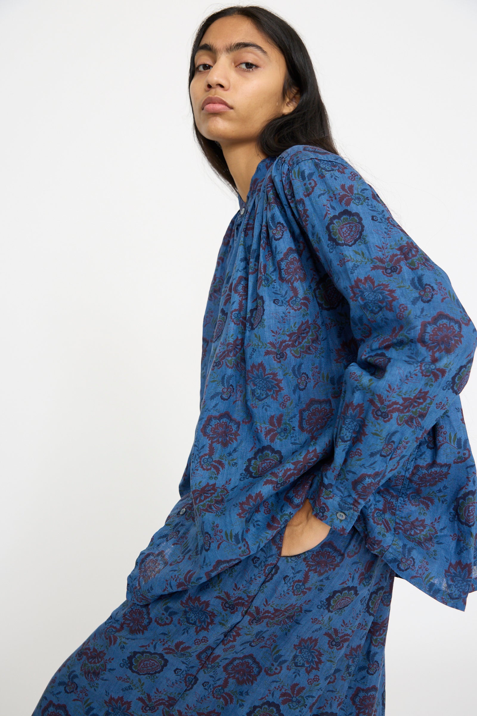 A person wearing the Linen Flower Shirt in Overdye Blue by Ichi Antiquités stands against a plain background.