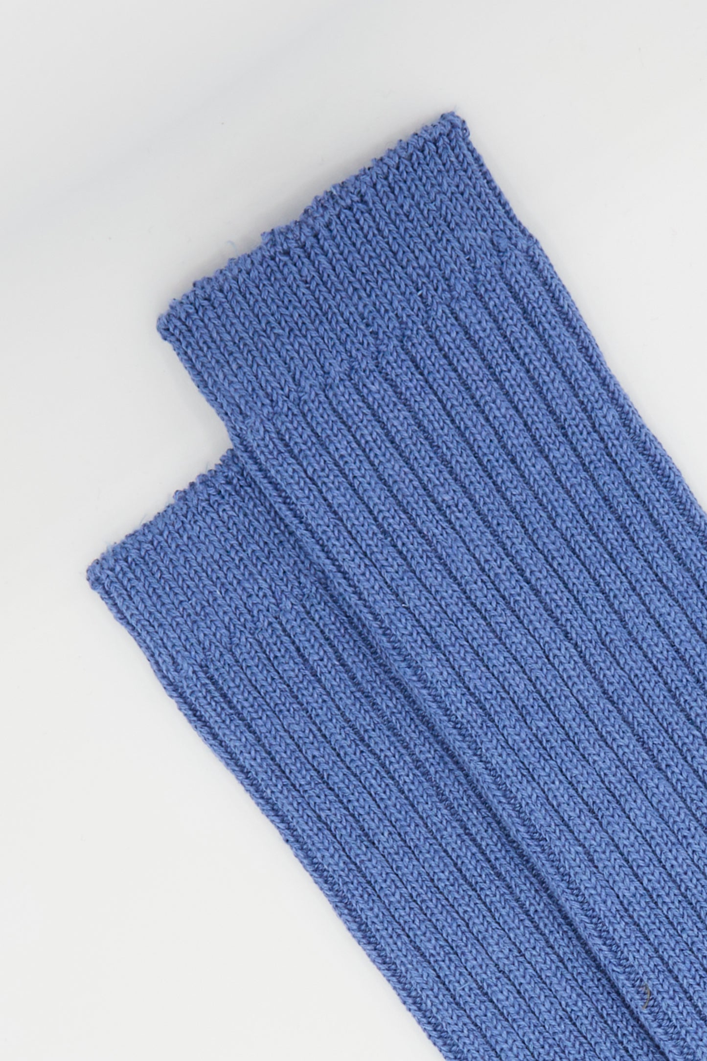 Two blue linen rib socks from Ichi Antiquités folded on a white background.