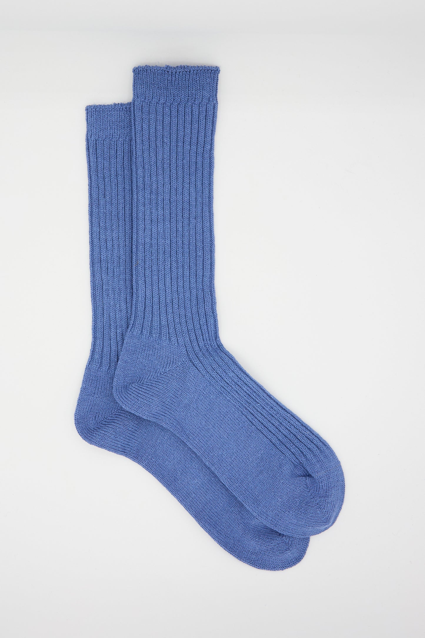 A pair of Linen Rib Socks in Blue by Ichi Antiquités is laid flat on a white background.