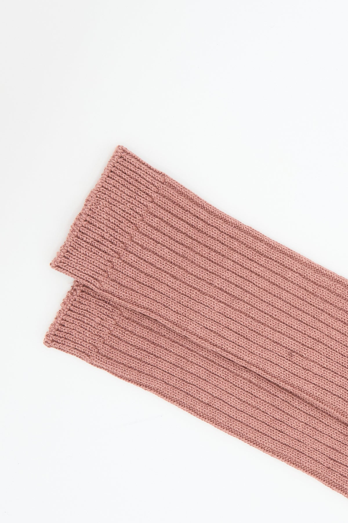 A pair of dusty pink Linen Rib Socks in Smoke Pink by Ichi Antiquités laid flat.