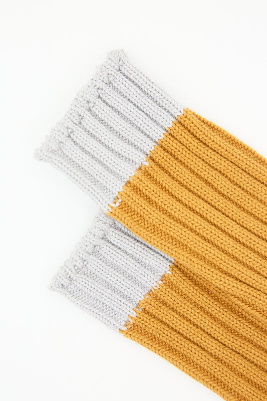 Two Organic Cotton Rib Socks in Mustard, crafted by Ichi Antiquités, laid out on a white background.